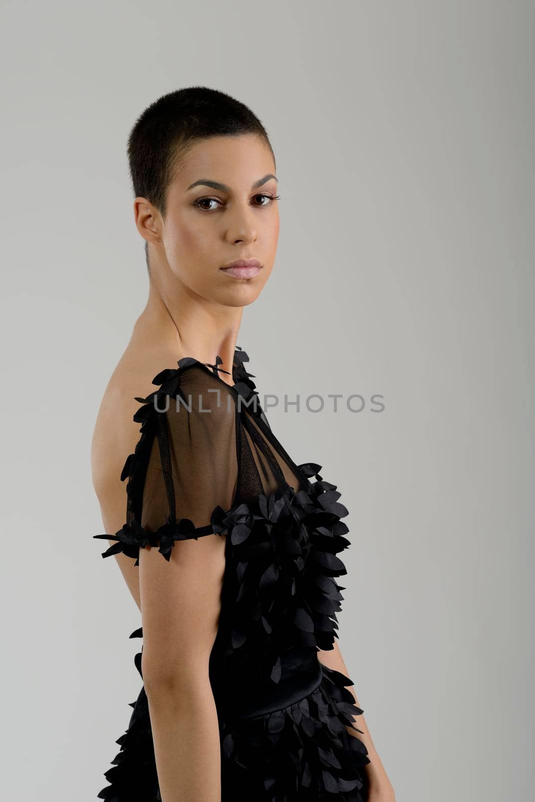 elegant woman in  fashionable  stylish dress posing in the studio