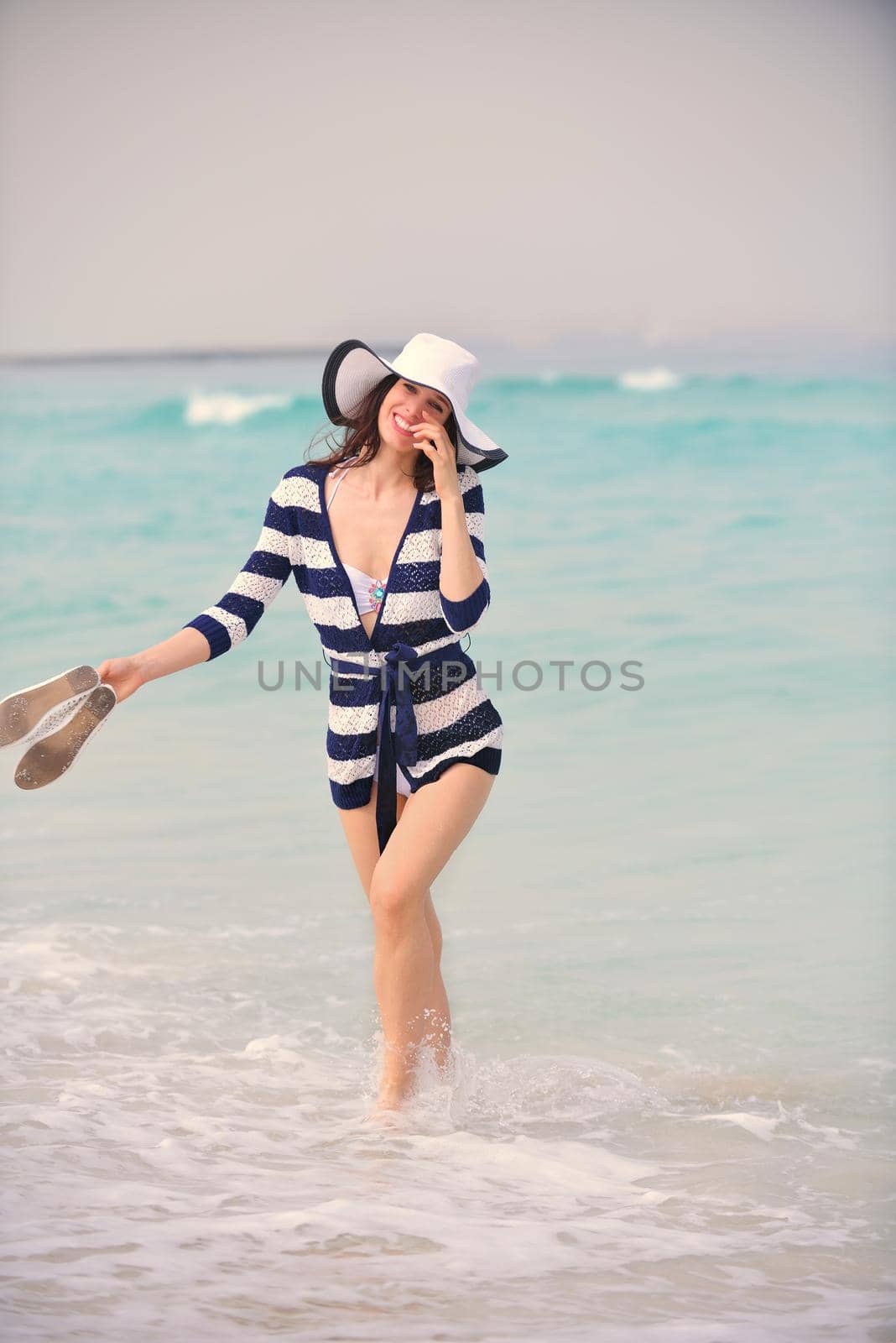 Happy Beautiful Woman Enjoying Summer Vacation on beach