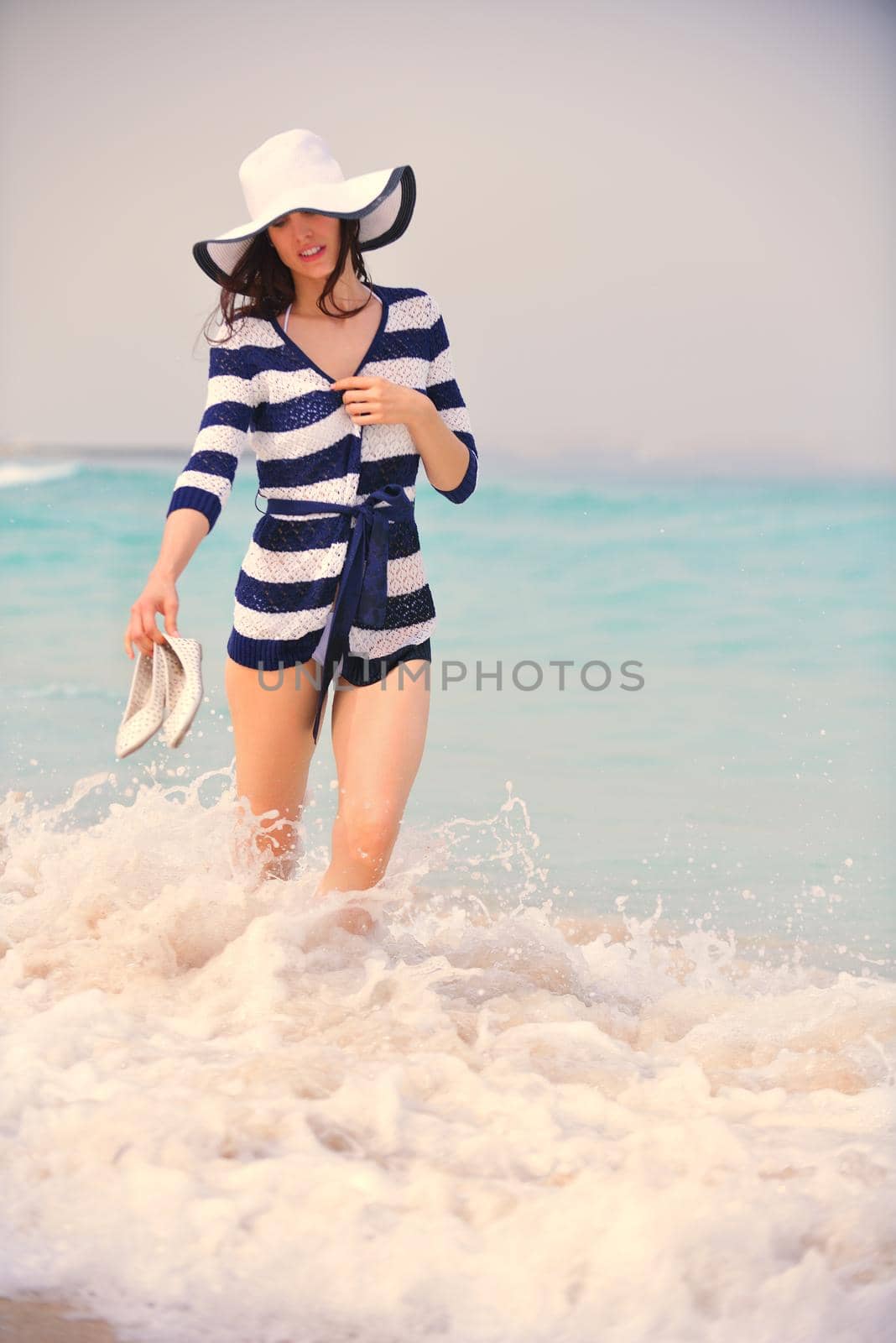 Happy Beautiful Woman Enjoying Summer Vacation on beach