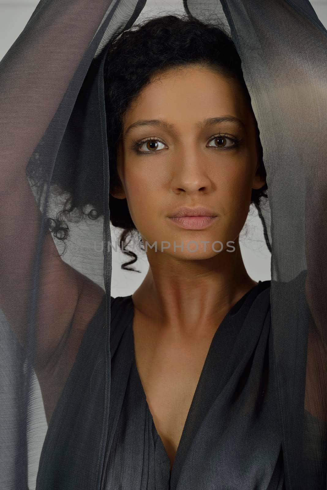 elegant woman in  fashionable  stylish dress posing in the studio