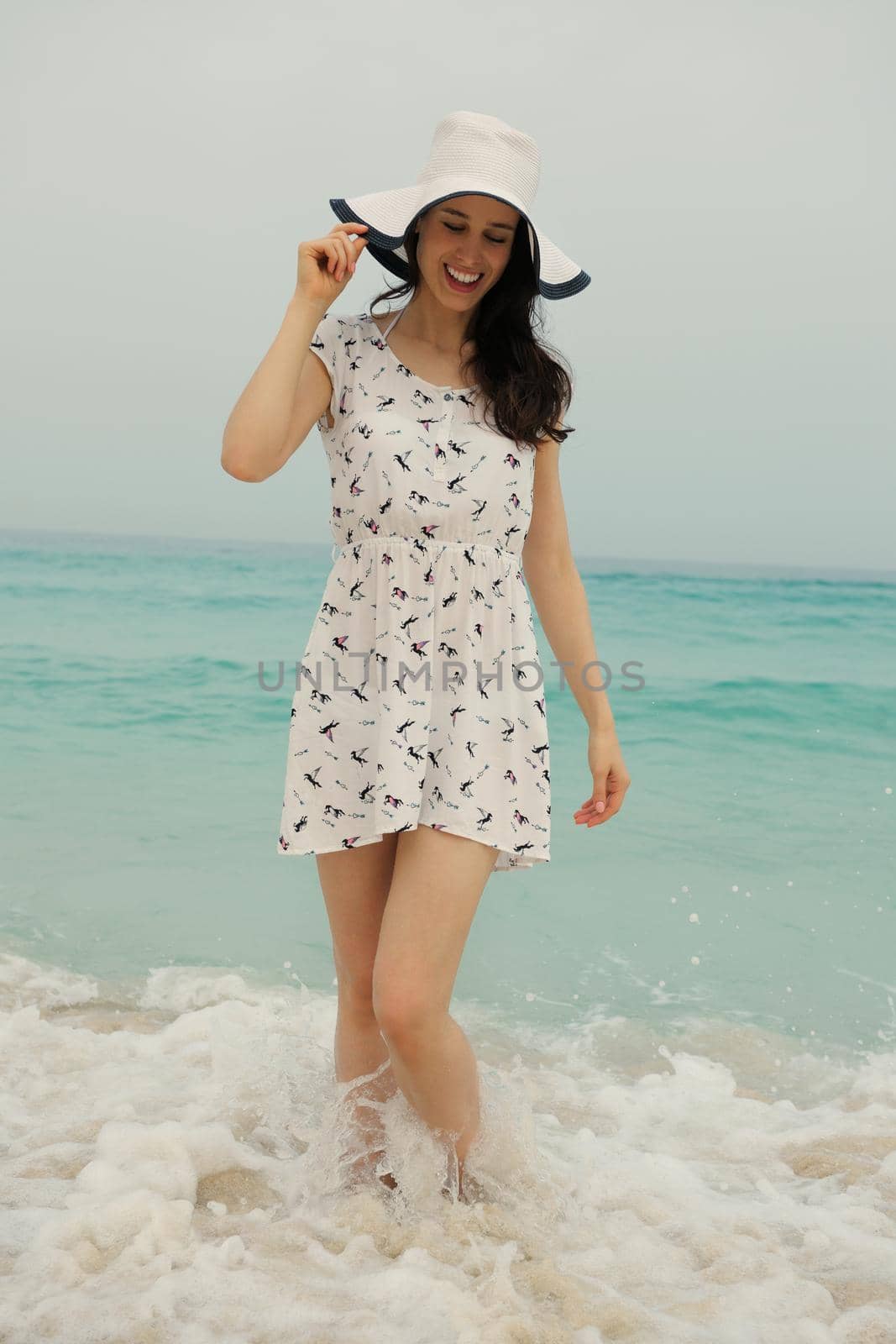 Happy Beautiful Woman Enjoying Summer Vacation on beach