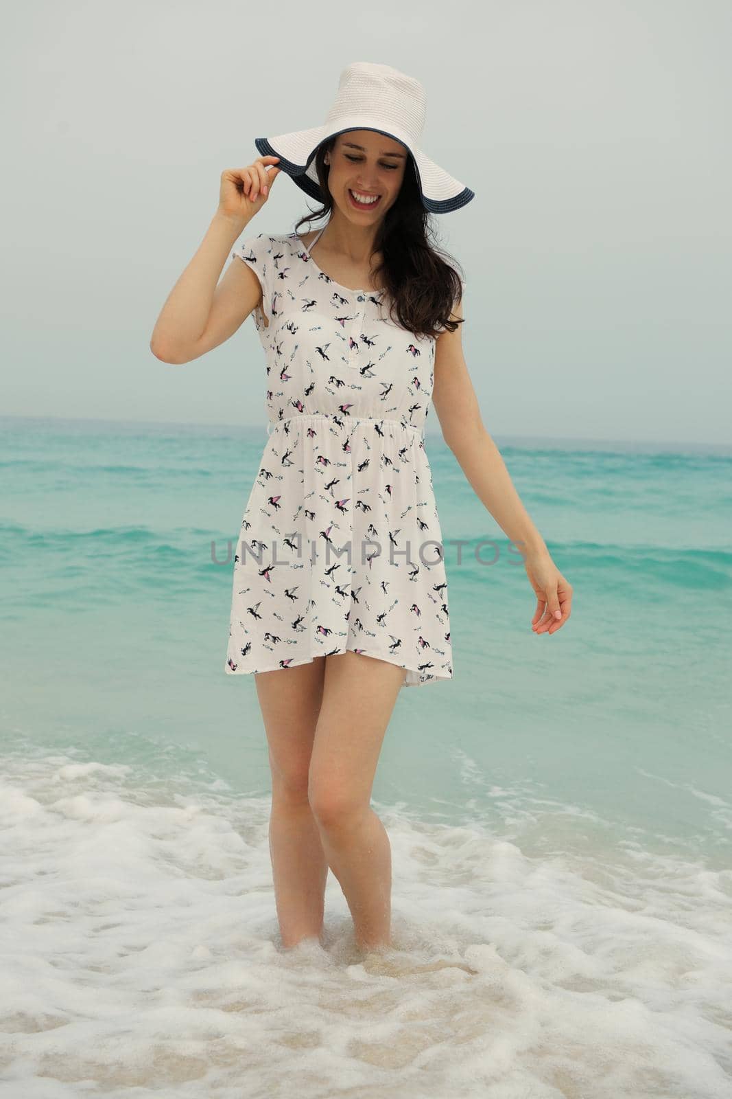 Happy Beautiful Woman Enjoying Summer Vacation on beach