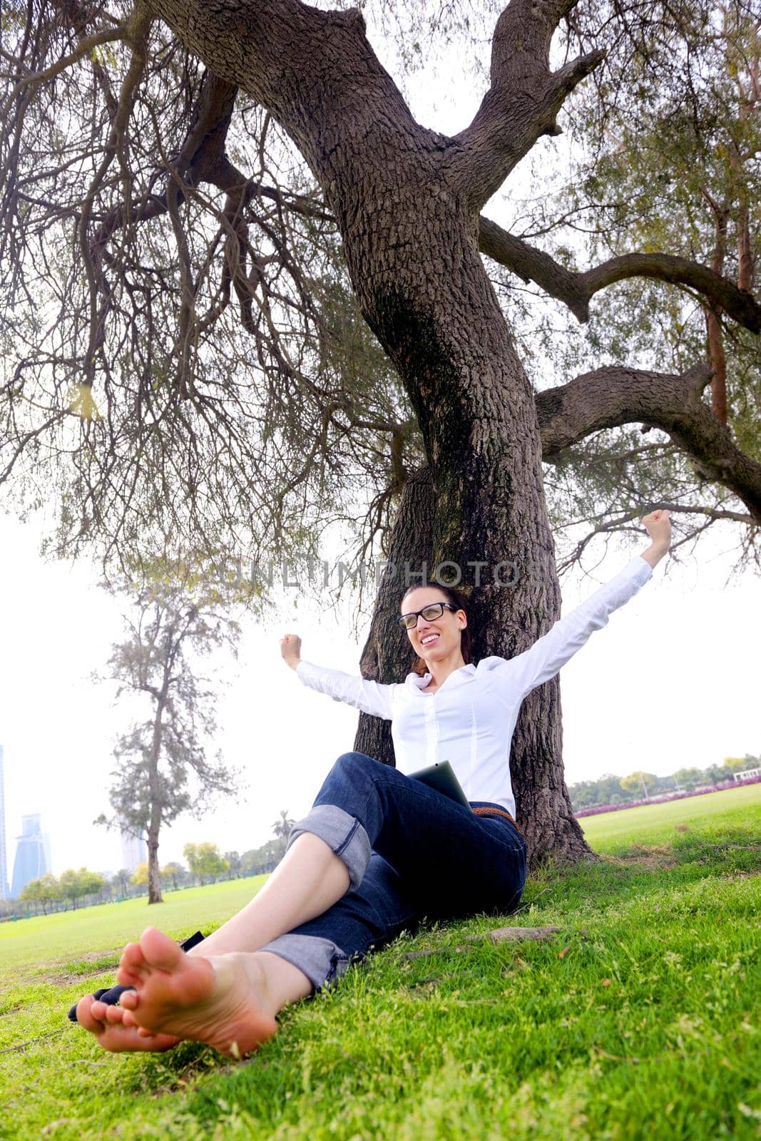 Beautiful young student  woman study with tablet in park