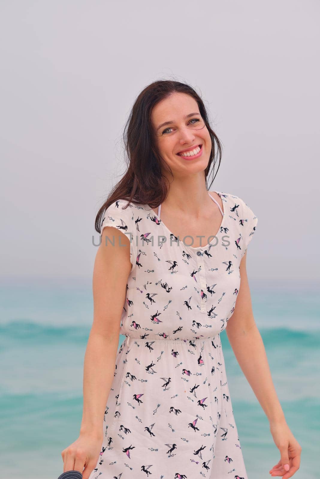 Happy Beautiful Woman Enjoying Summer Vacation on beach