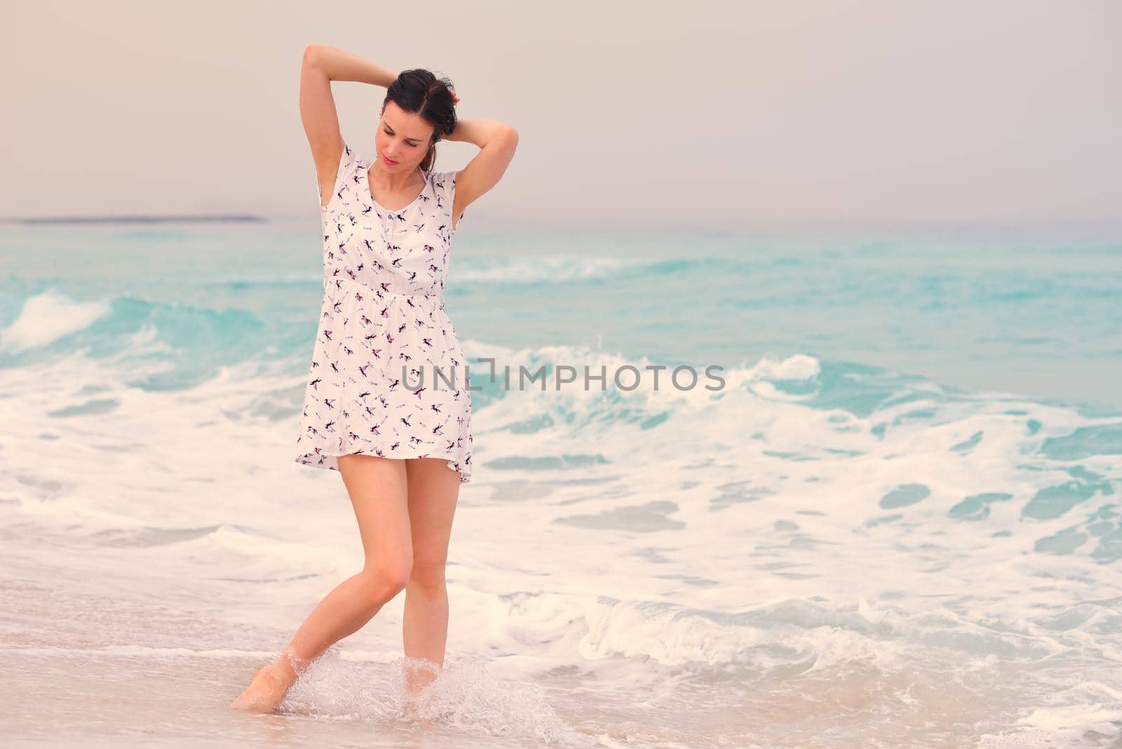 Happy Beautiful Woman Enjoying Summer Vacation on beach