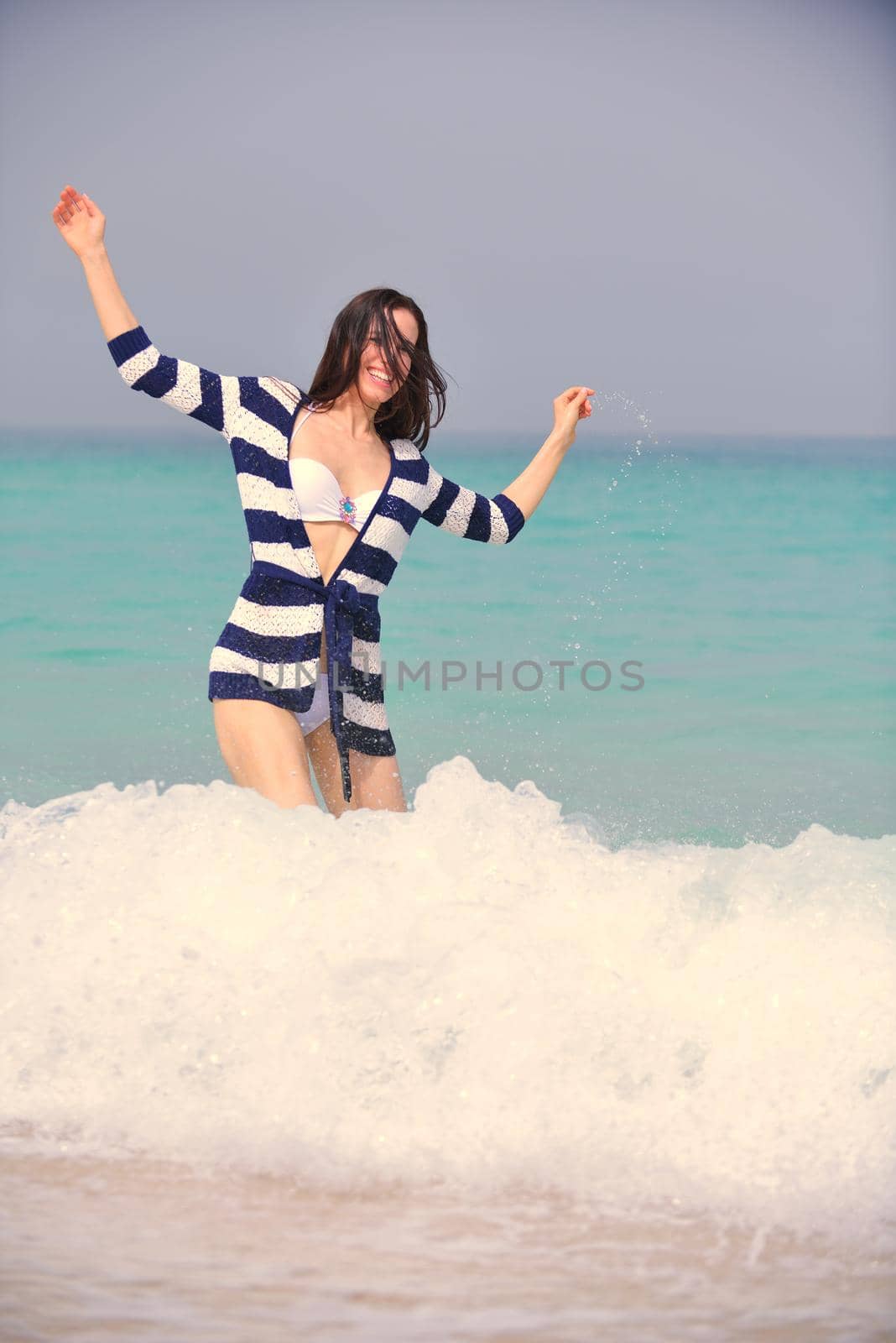 Happy Beautiful Woman Enjoying Summer Vacation on beach