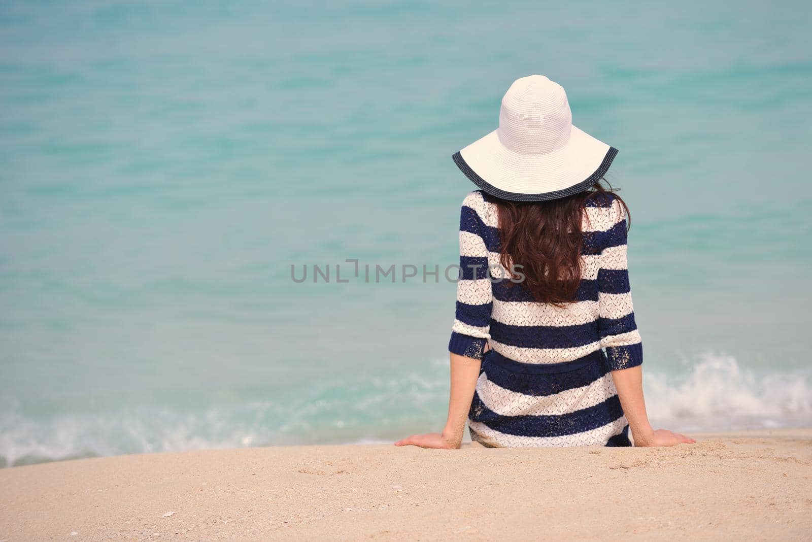 Happy Beautiful Woman Enjoying Summer Vacation on beach