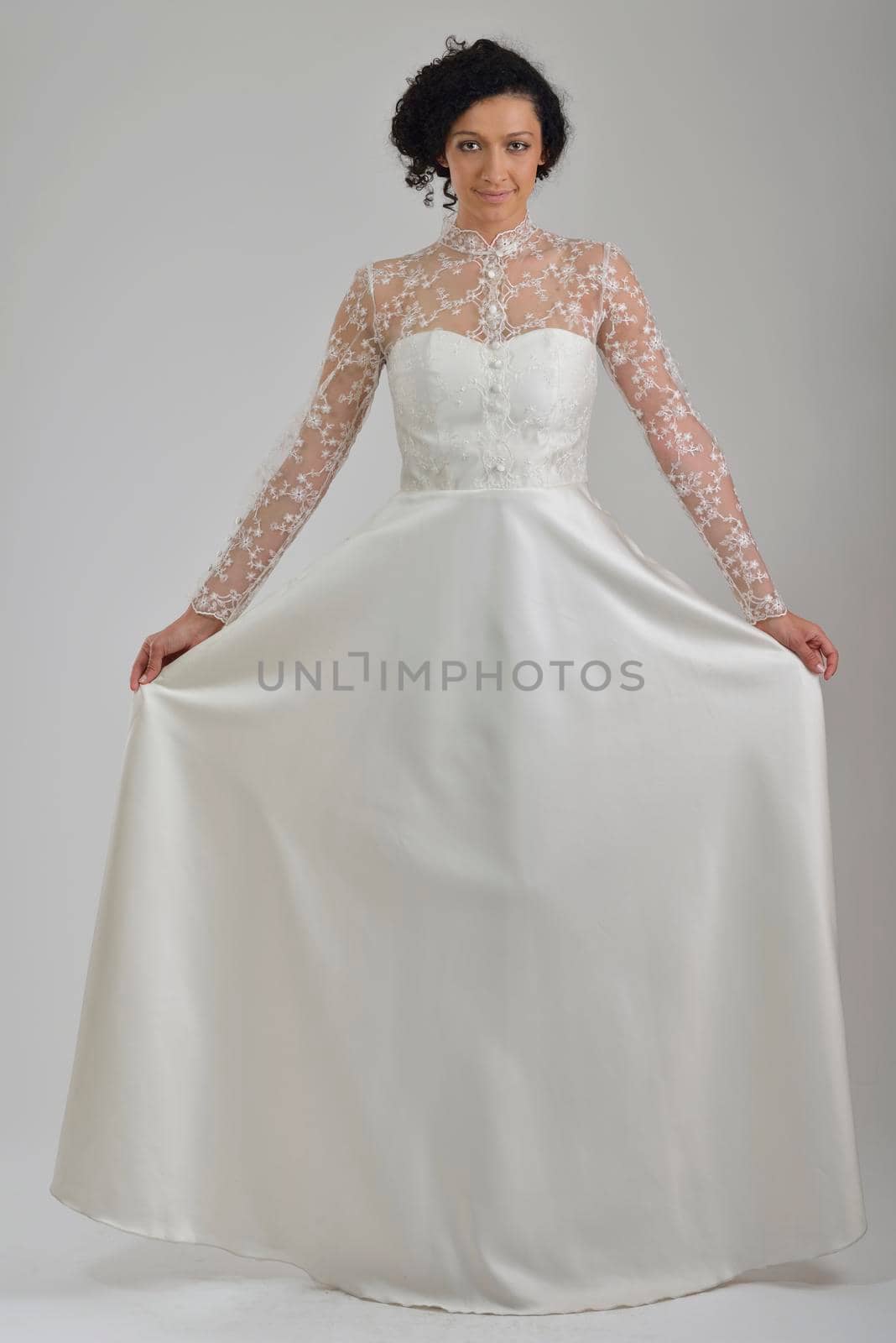 elegant woman in  fashionable  stylish dress posing in the studio