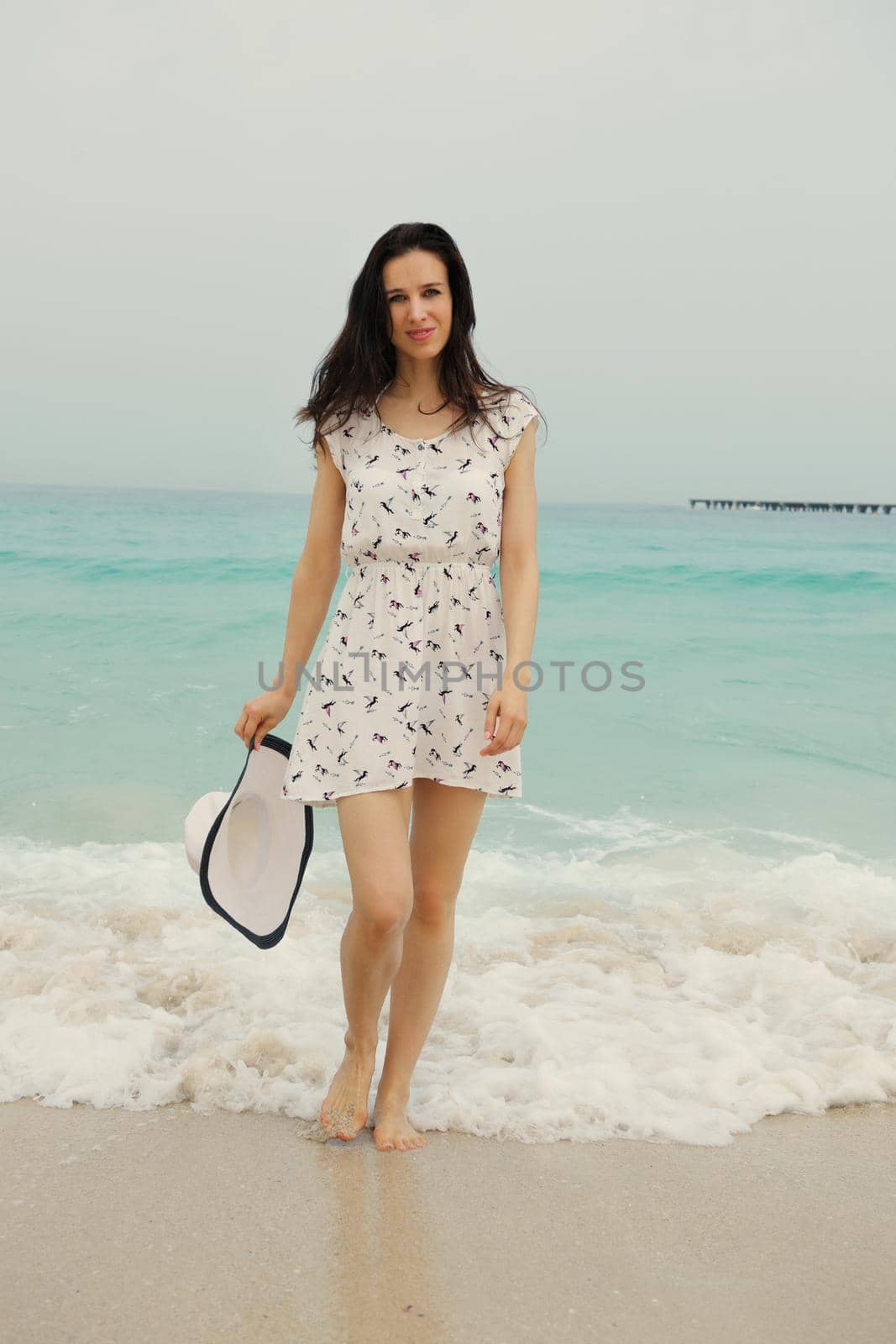 Happy Beautiful Woman Enjoying Summer Vacation on beach