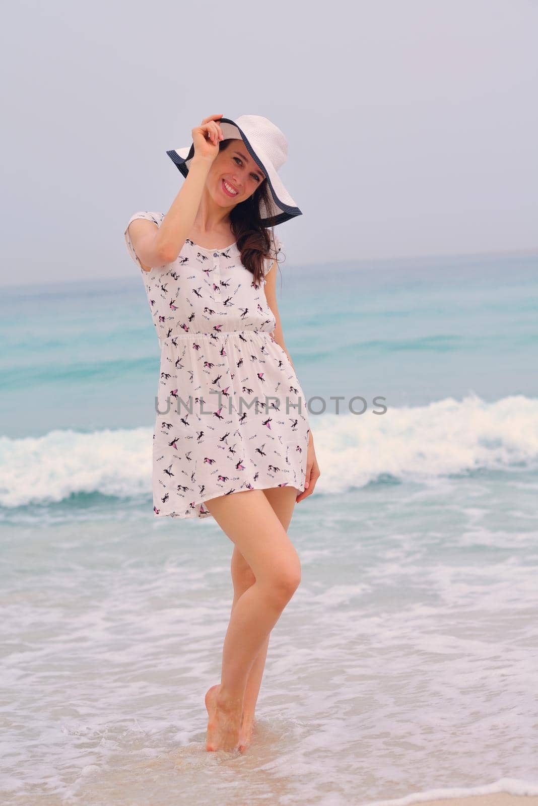 Happy Beautiful Woman Enjoying Summer Vacation on beach