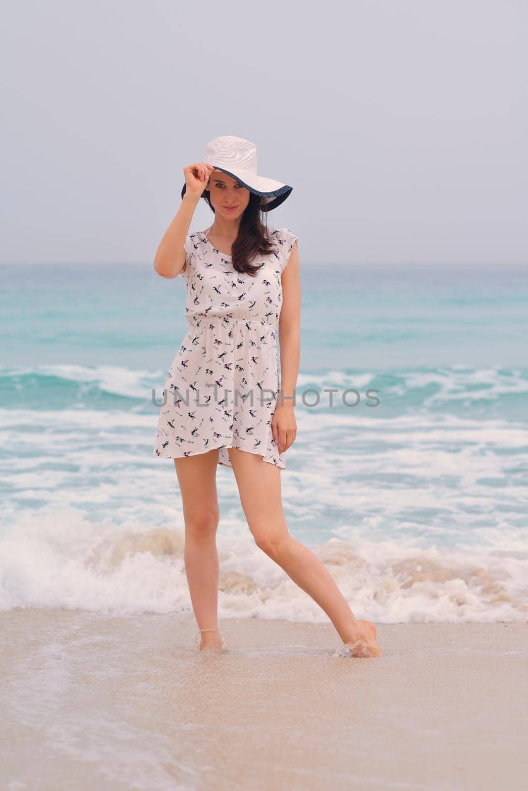 Happy Beautiful Woman Enjoying Summer Vacation on beach