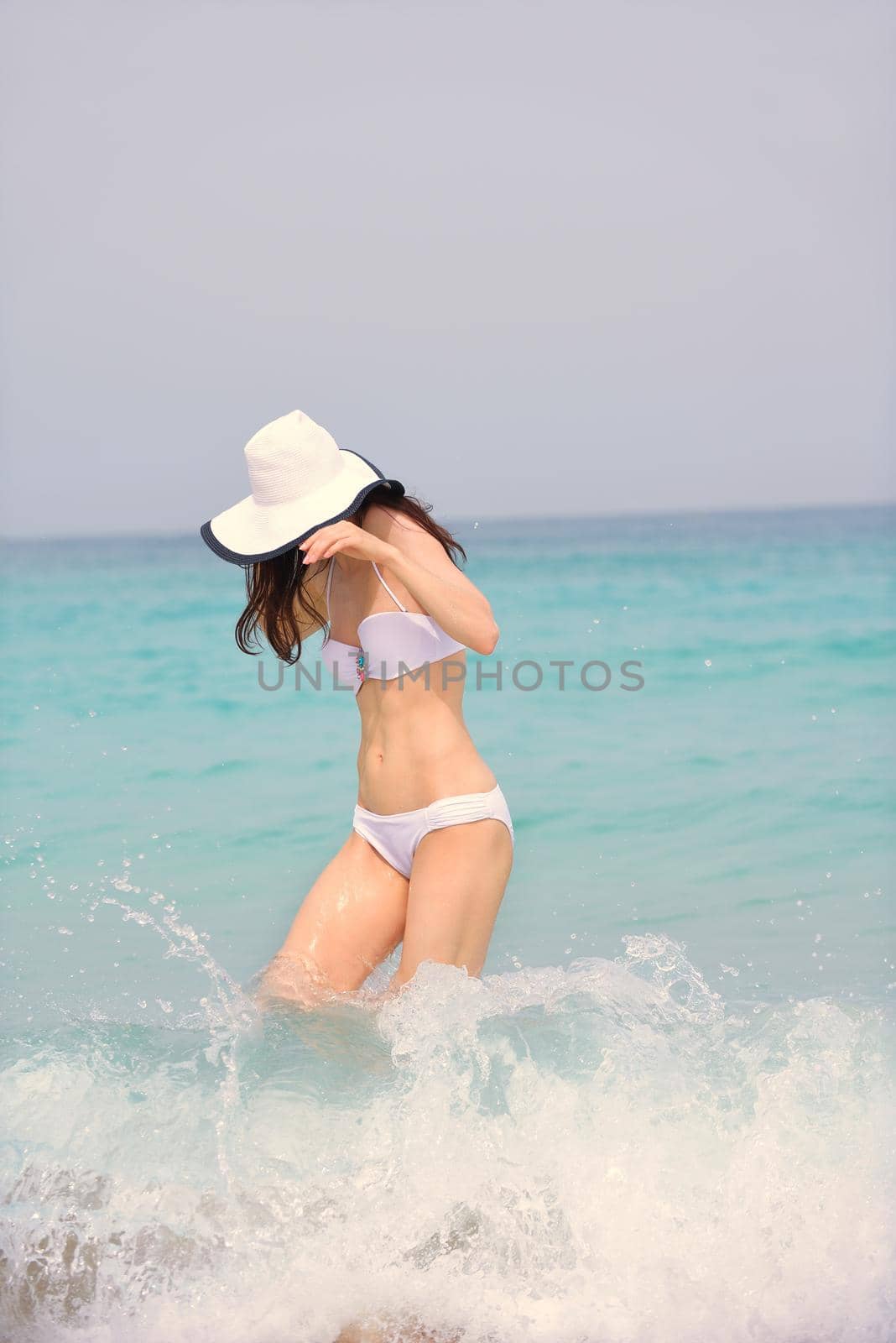 beautifel and happy woman girl on beach have fun and relax on summer vacation  over the beautiful tropical sea