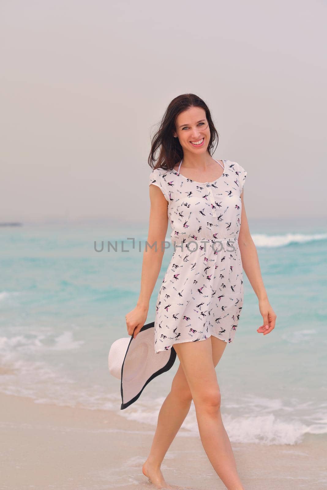 Happy Beautiful Woman Enjoying Summer Vacation on beach