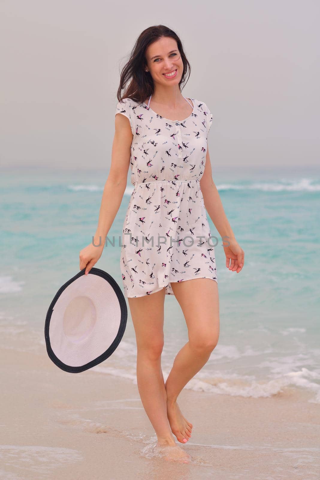 Happy Beautiful Woman Enjoying Summer Vacation on beach