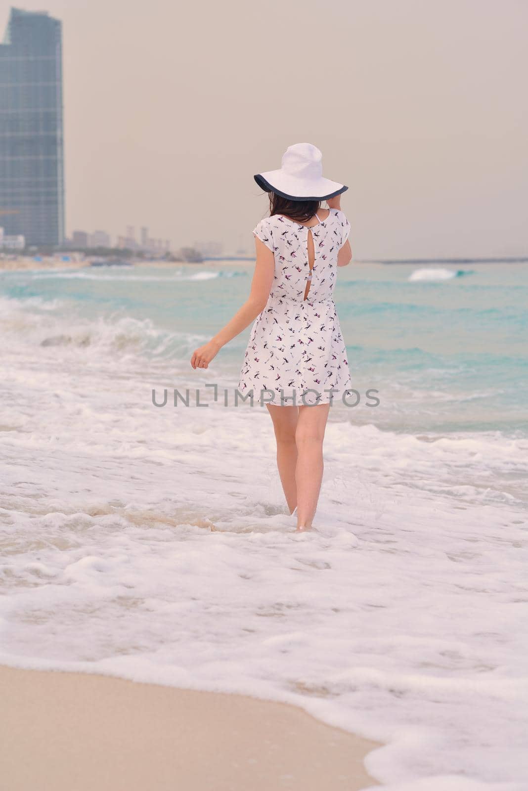 Happy Beautiful Woman Enjoying Summer Vacation on beach