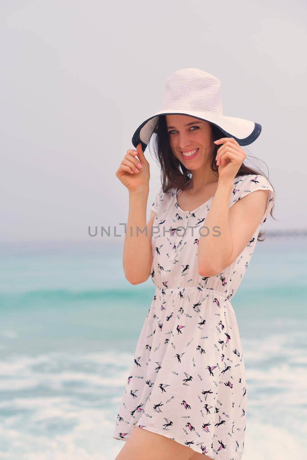 Happy Beautiful Woman Enjoying Summer Vacation on beach