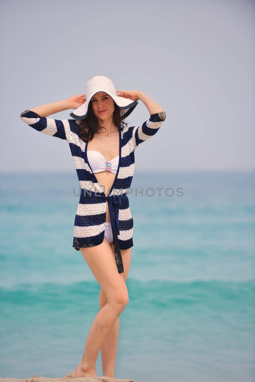 Happy Beautiful Woman Enjoying Summer Vacation on beach