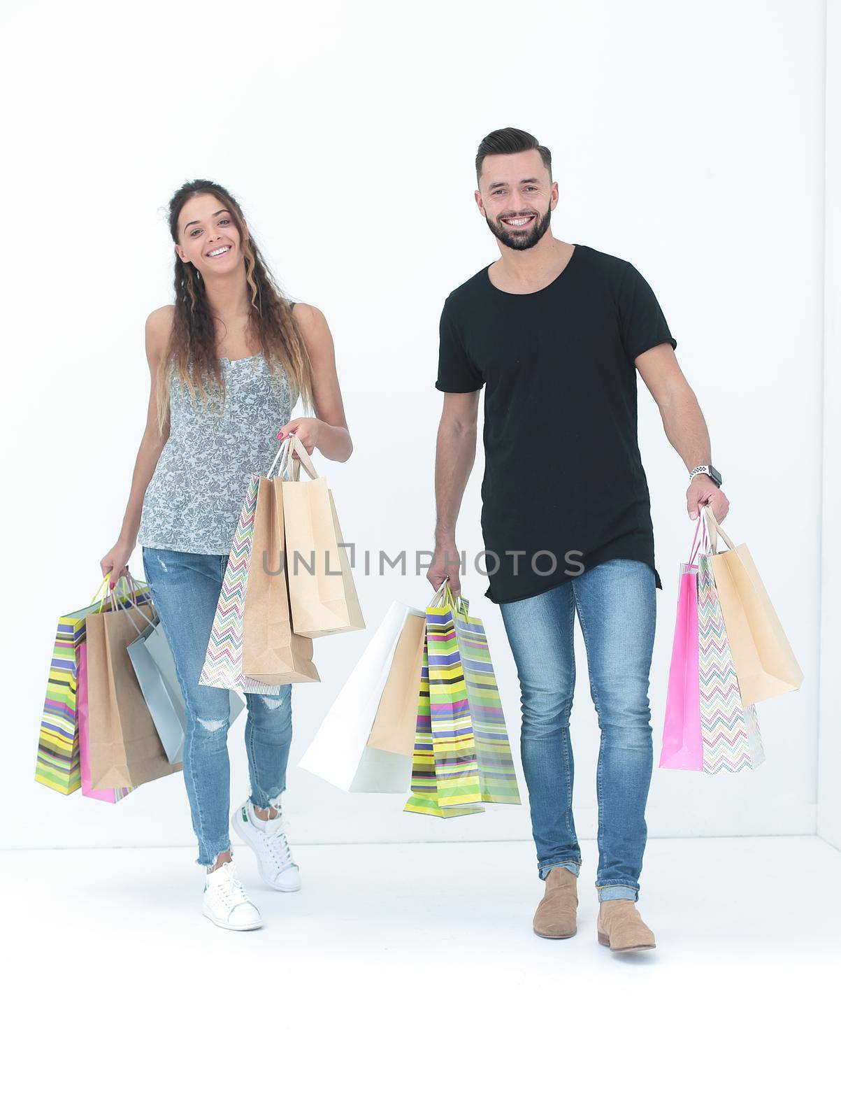Couple with shopping bags, isolated on white background