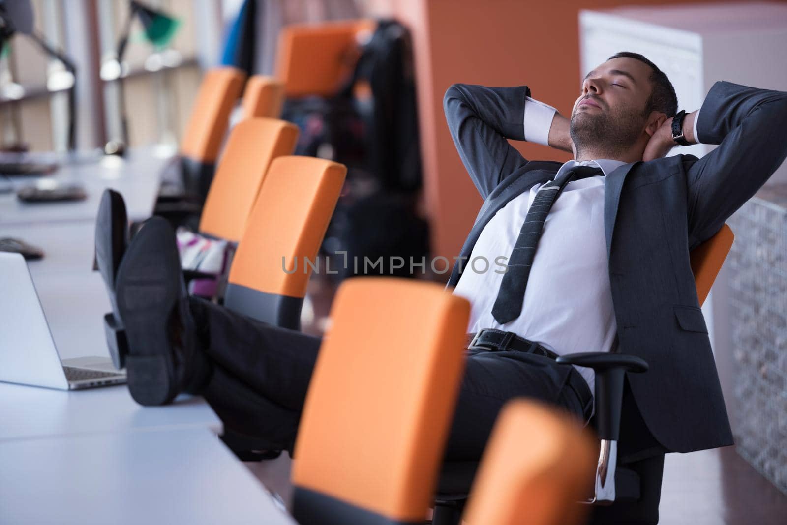 happy young business man portrait in bright modern office indoor