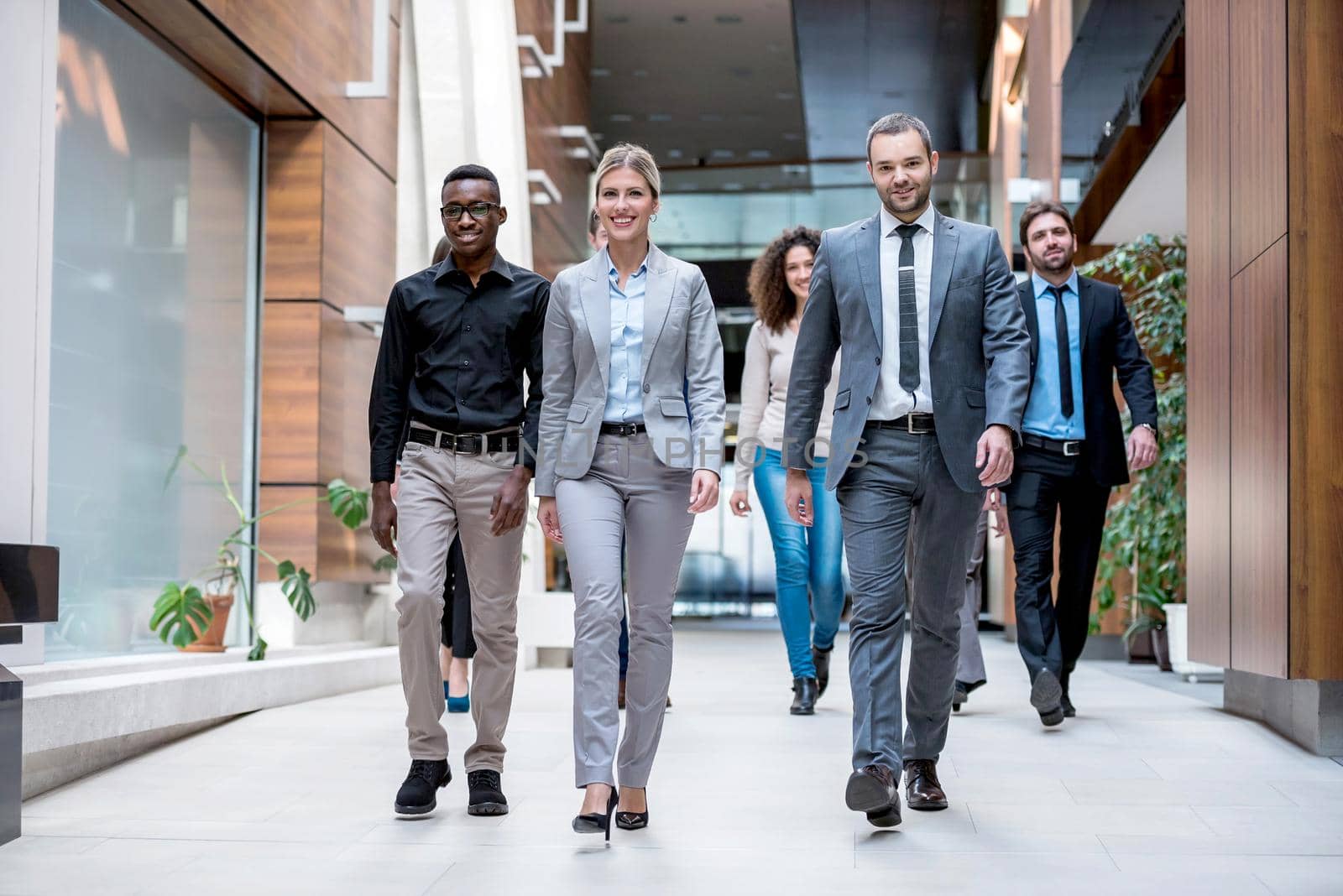 young multi ethnic business people group walking standing and top view