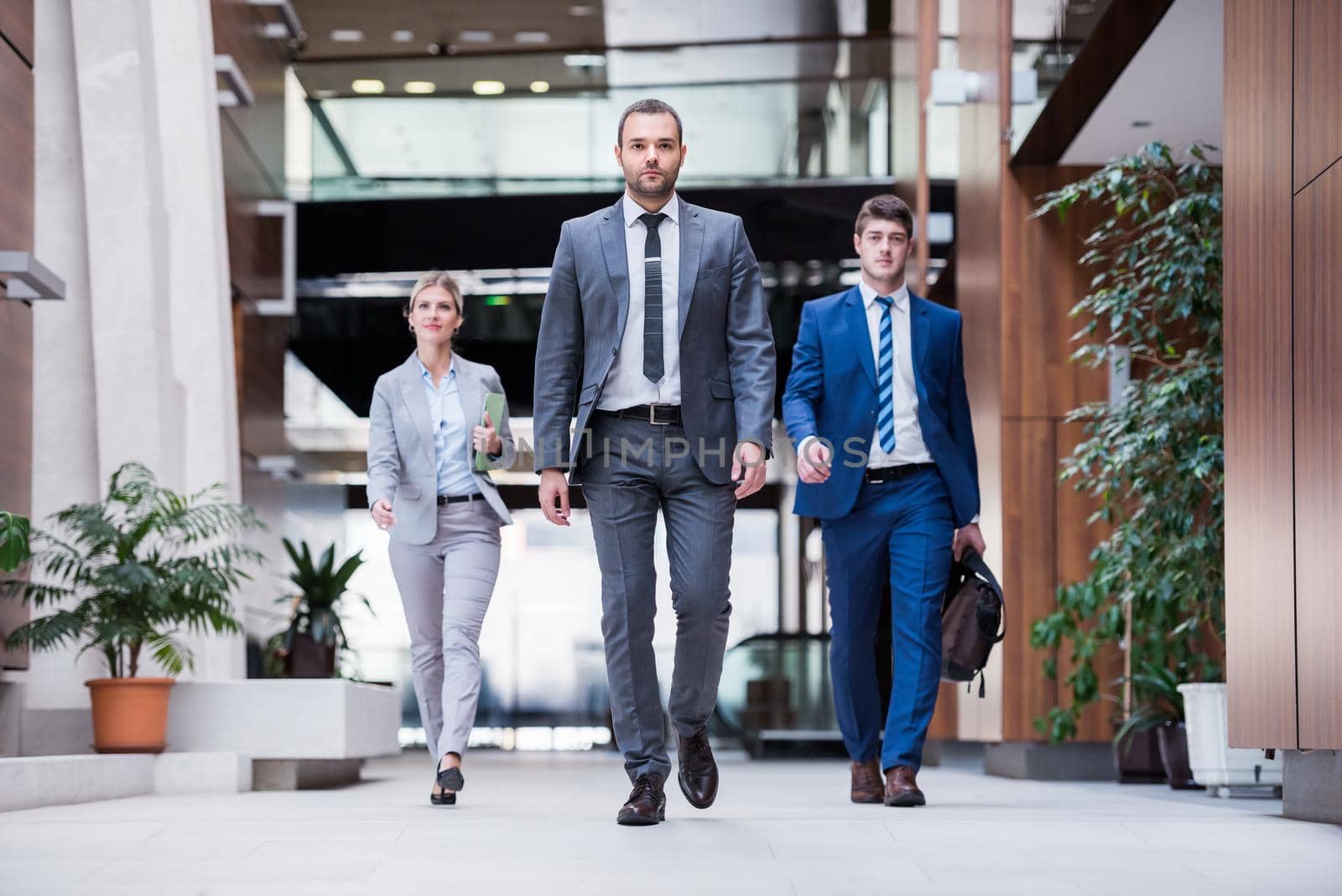 young multi ethnic business people group walking standing and top view