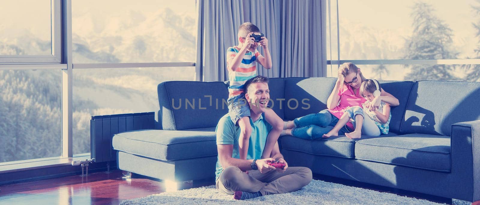 Happy family playing a video game by dotshock