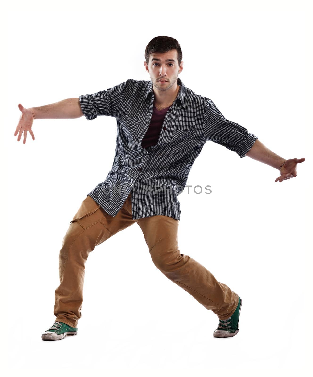 young boy man teen dancing and jumping isolated on white background in studio