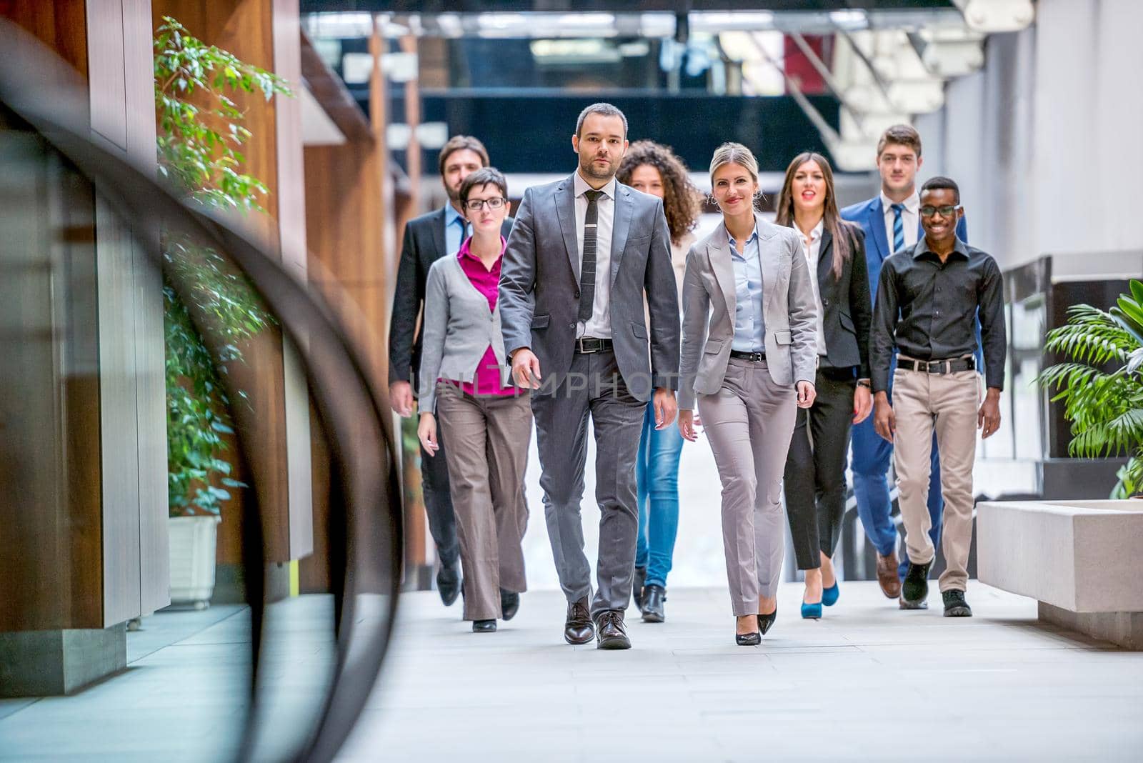 young multi ethnic business people group walking standing and top view