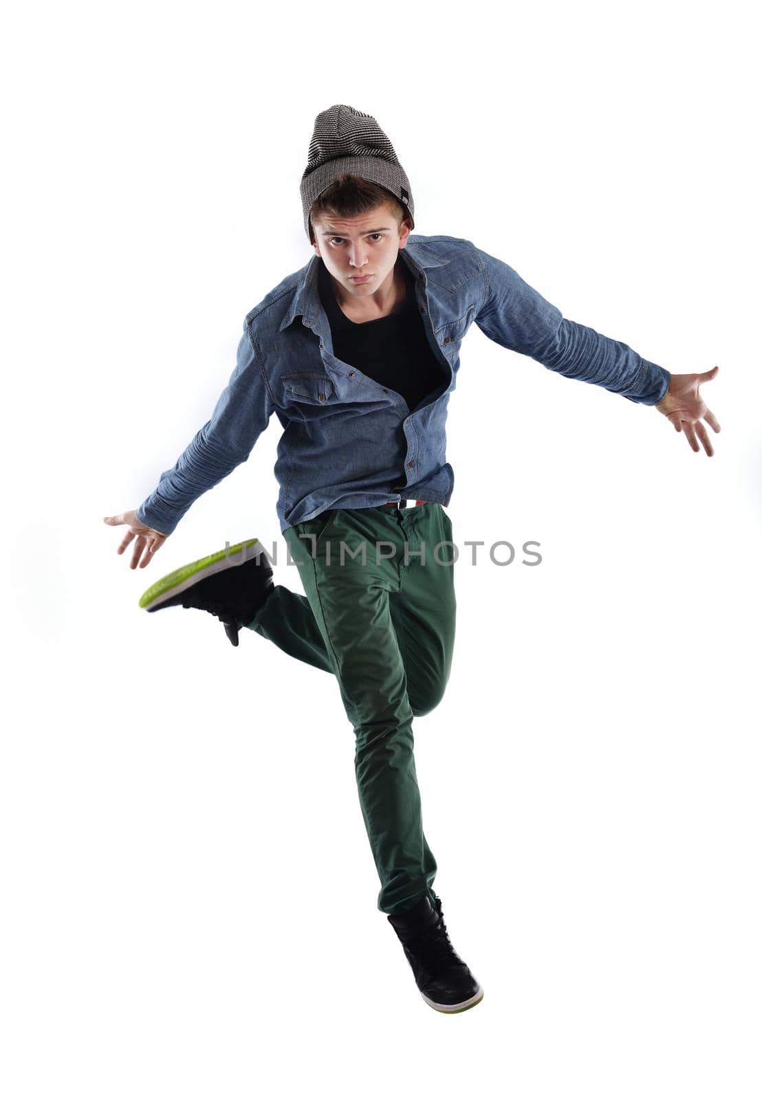 young boy man teen dancing and jumping isolated on white background in studio