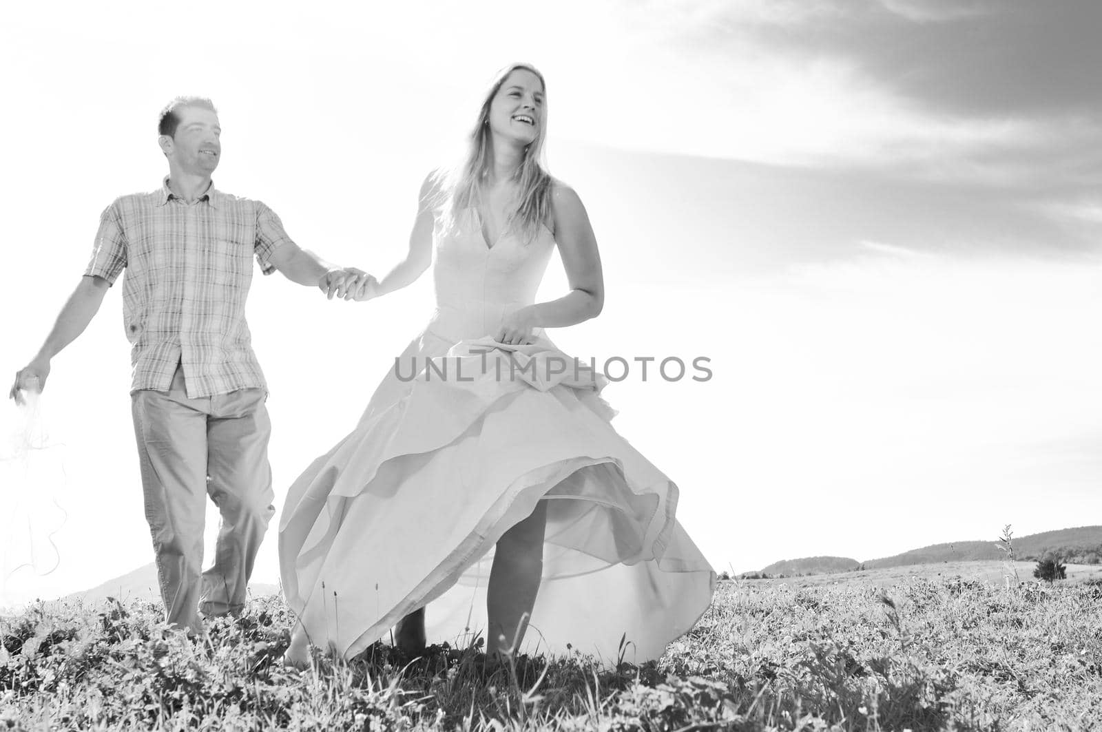 happy bride and groon outdoor by dotshock