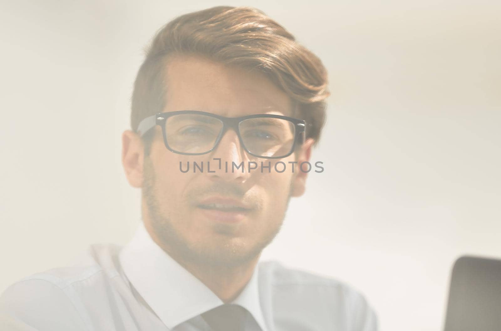 close up.successful young businessman sitting at his Desk. business people