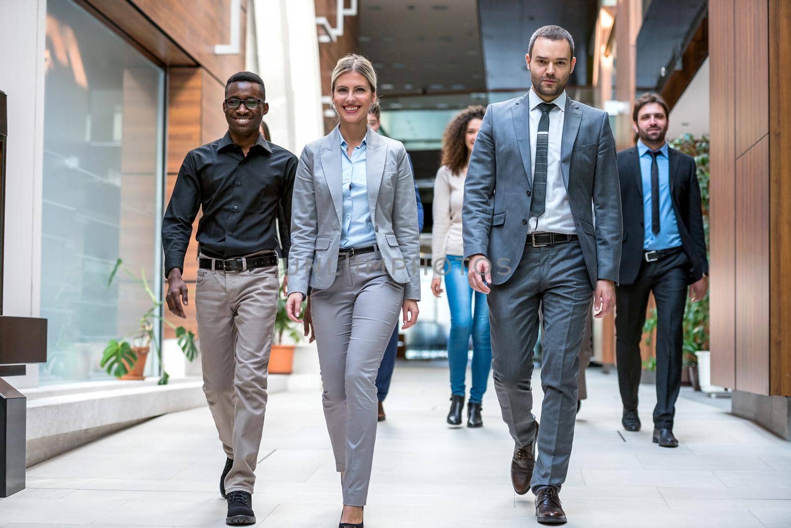 young multi ethnic business people group walking standing and top view