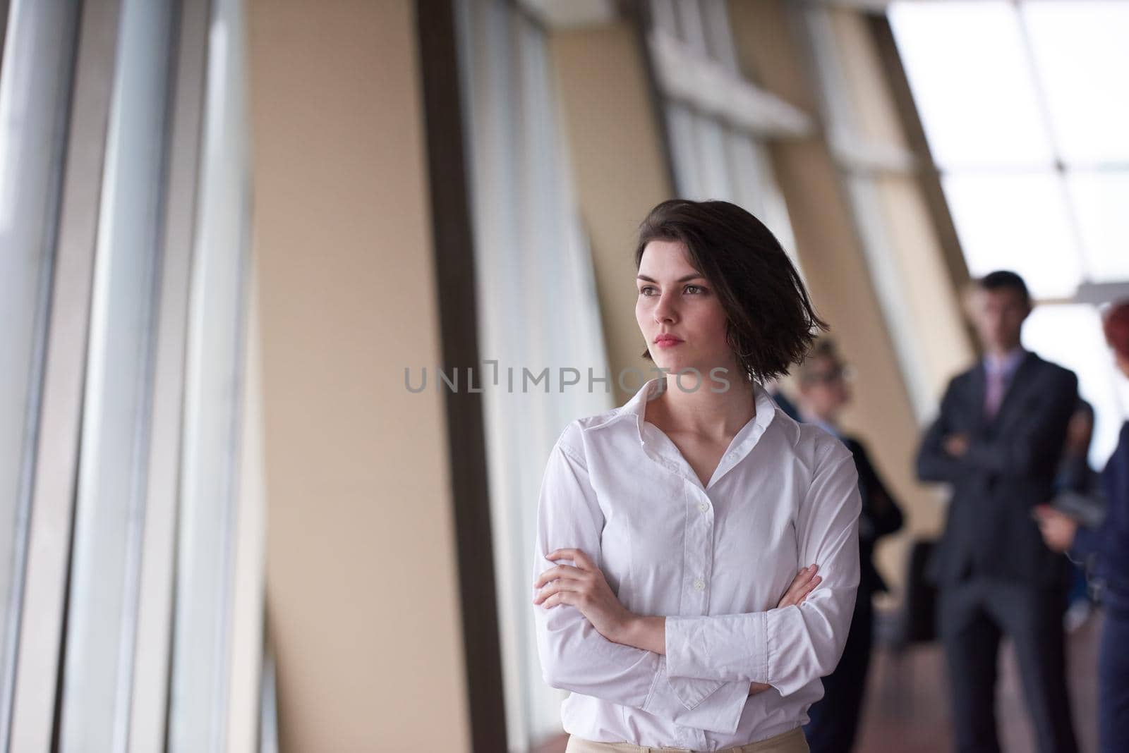 business people group, woman in front  as team leader by dotshock