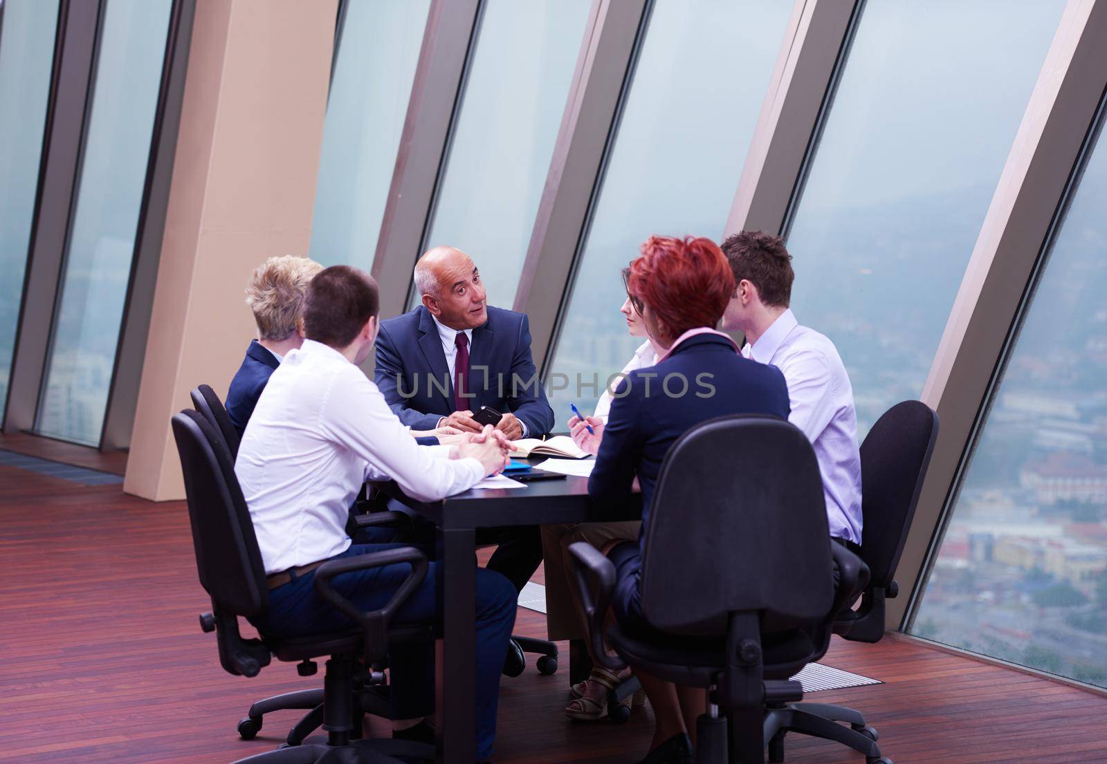 startup business people group have meeting in modern bright office interior, senoir investors  and young software  developers