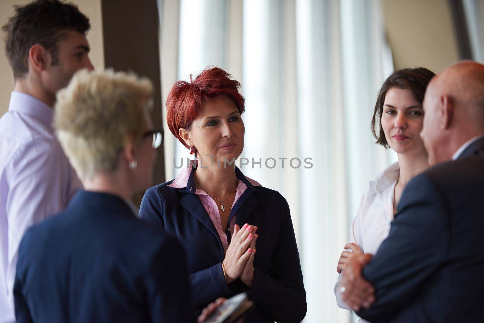 business people group on meeting at modern bright office by dotshock