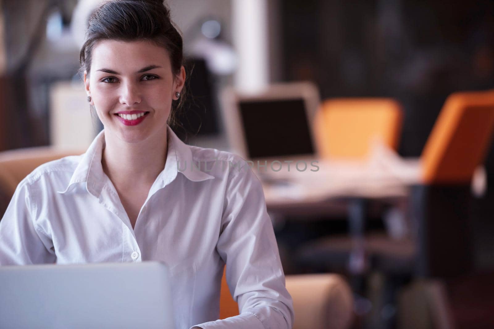 business woman with her staff, people group in background at modern bright office indoors