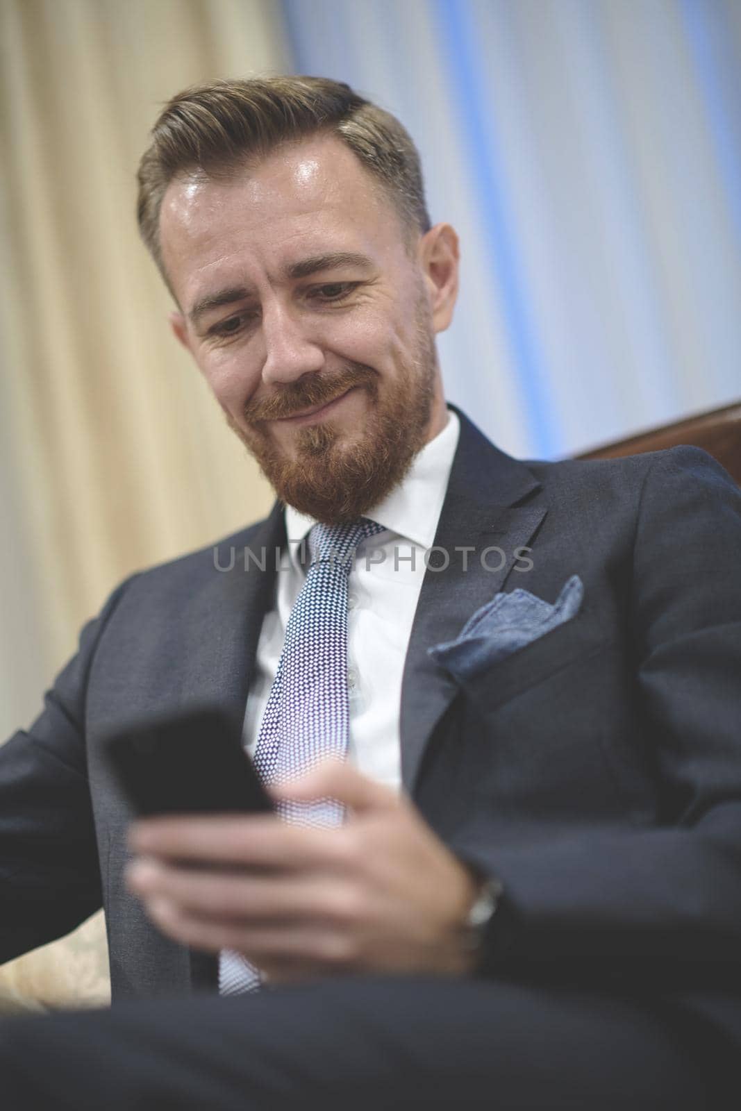 Senior executive businessman at luxury corporate workspace. Portrait of smiling ceo at modern office in stylish suit