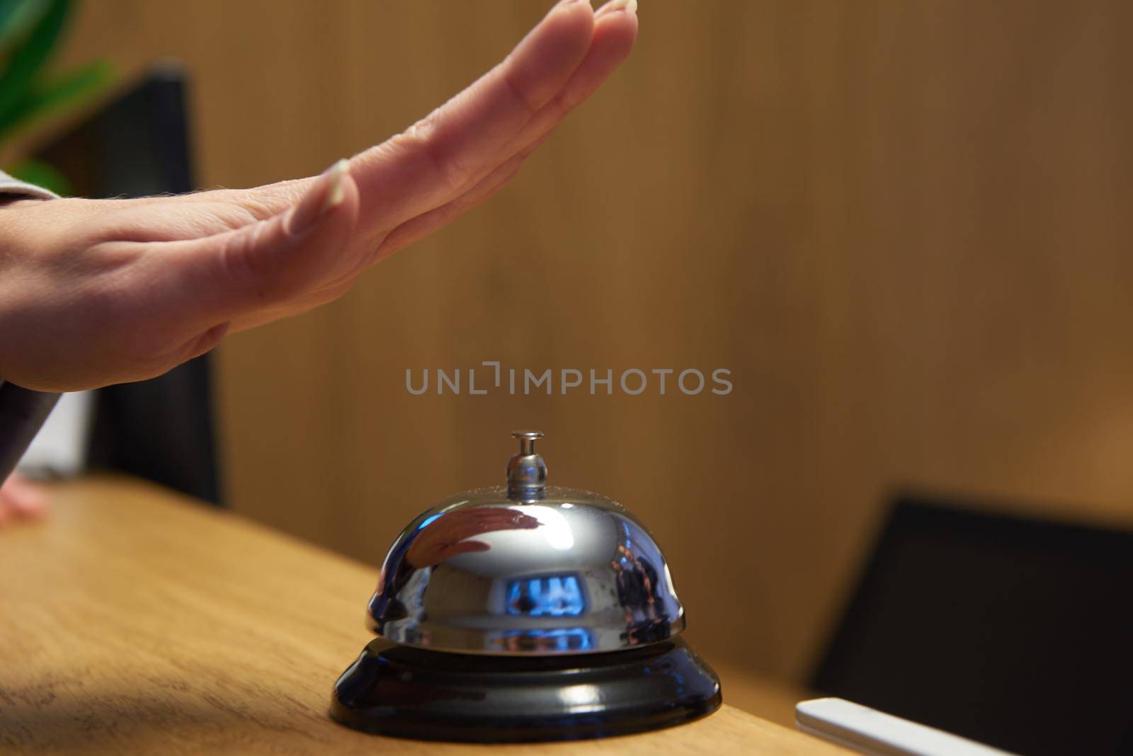 business woman at the reception of a hotel checking in