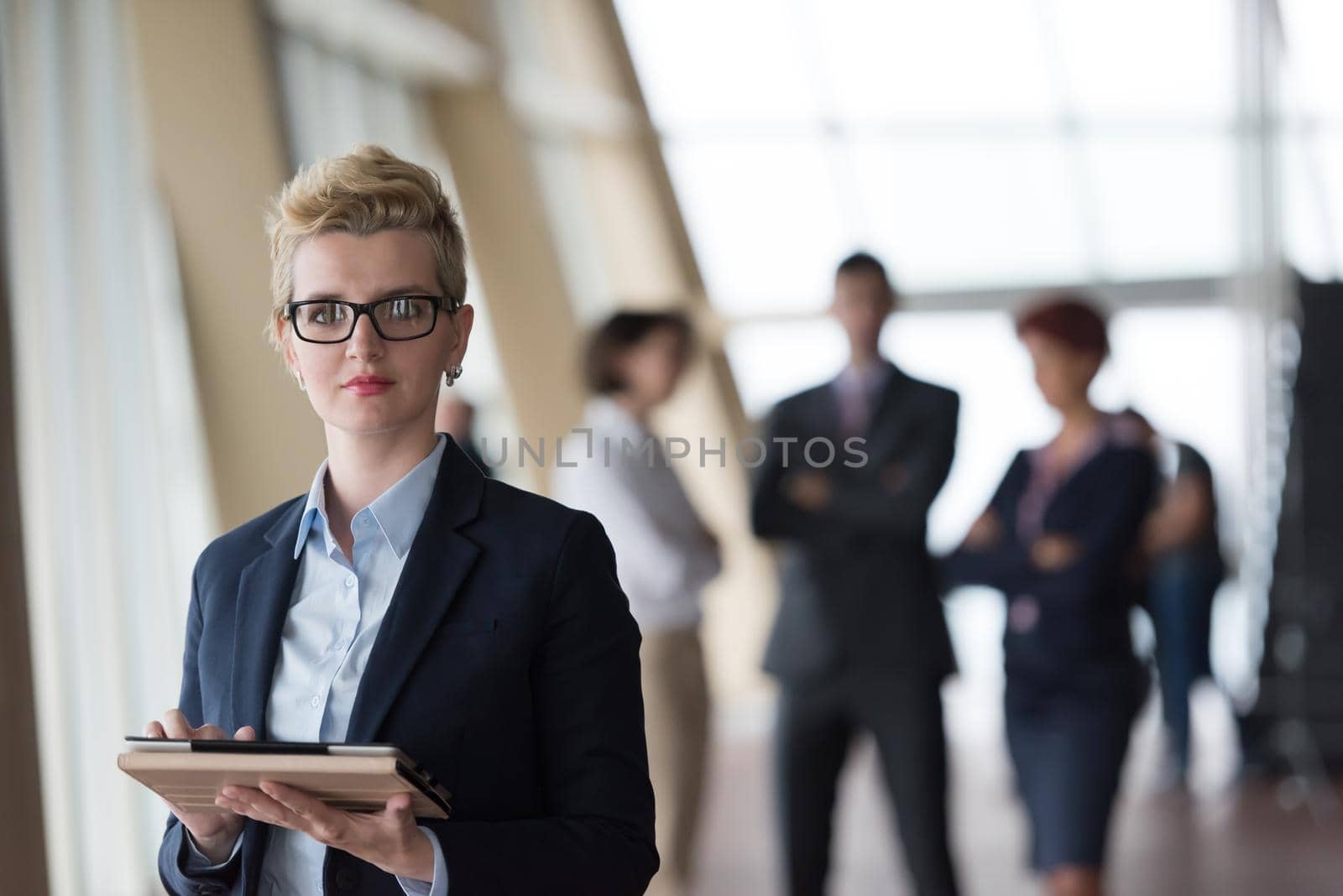 portrait of business woman  at office with tablet computer by dotshock