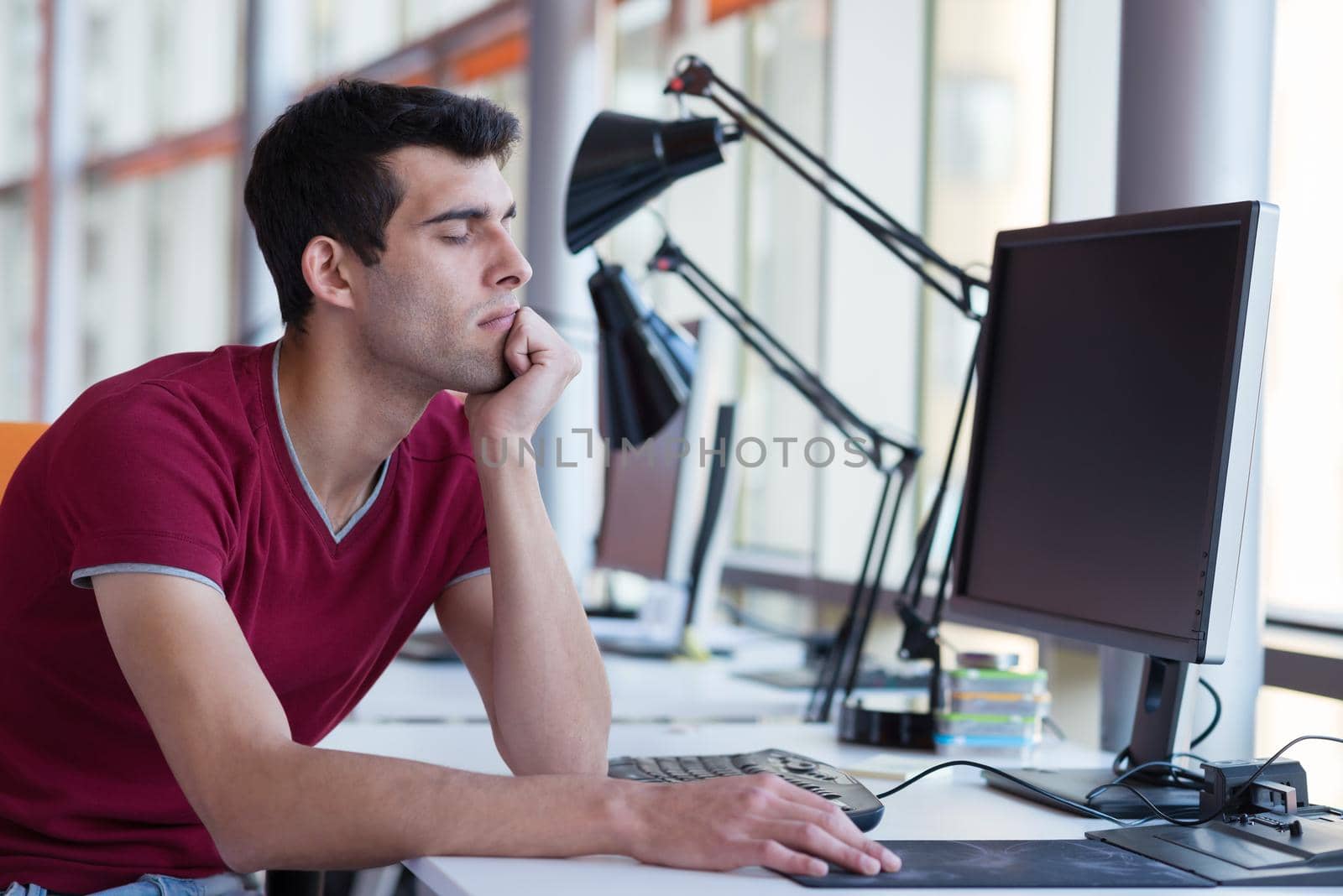 happy young business man portrait in bright modern office indoor