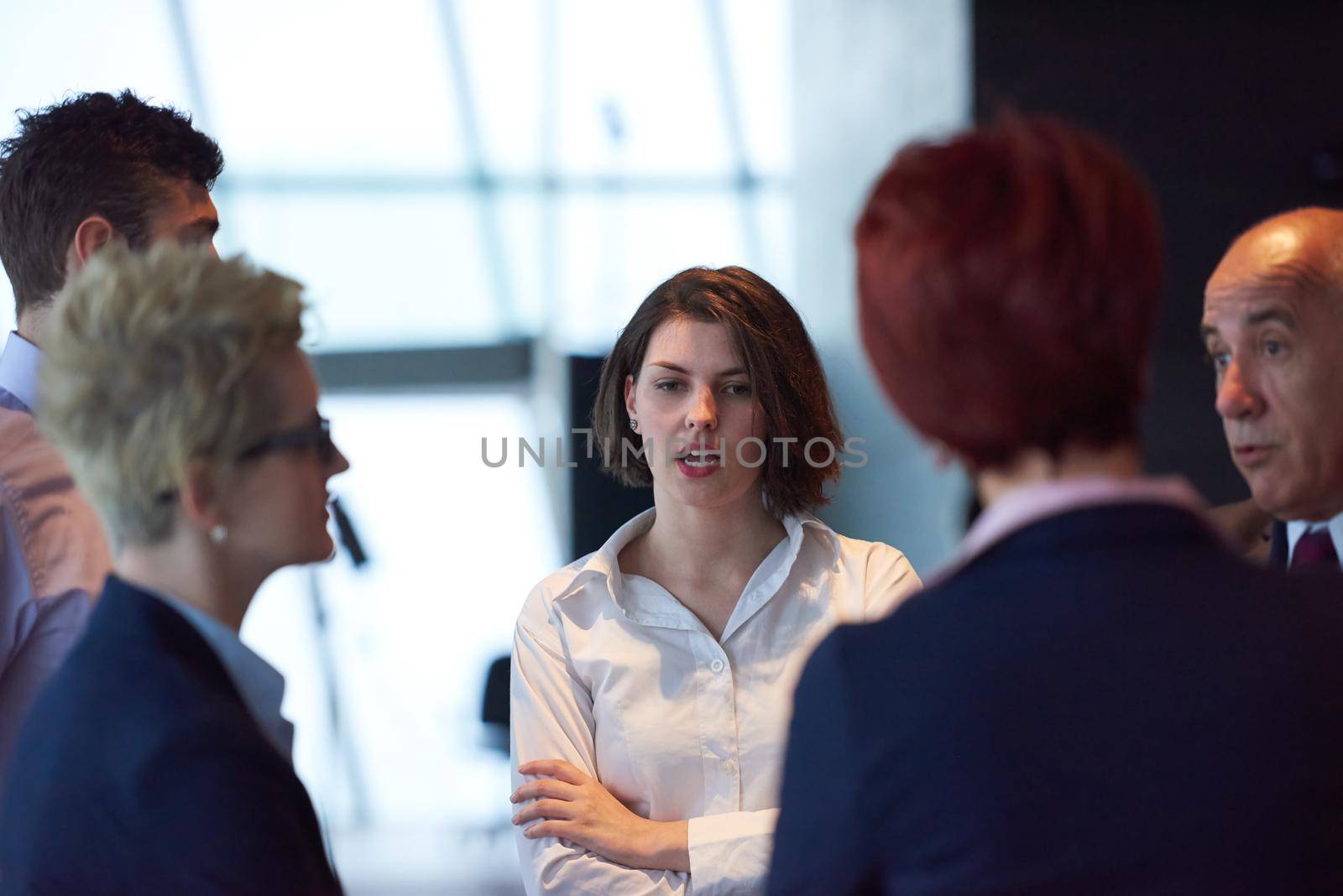 business people group on meeting at modern bright office by dotshock