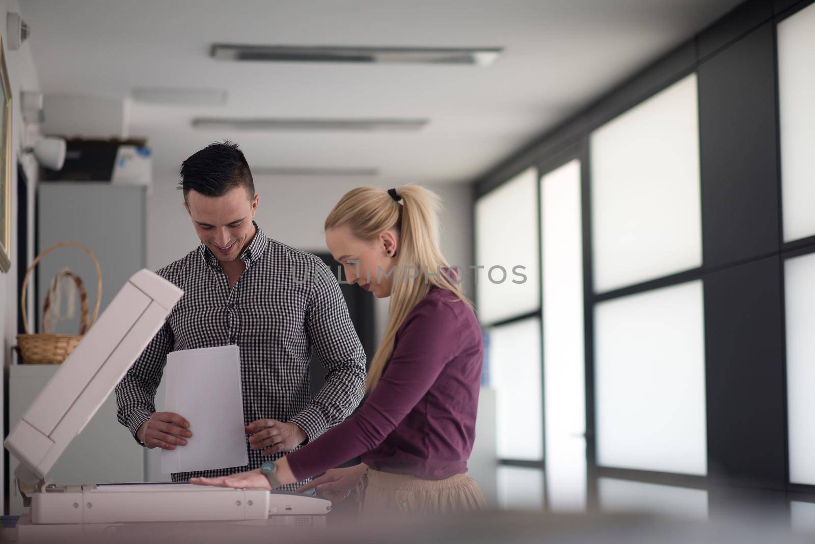 happy business people group at modern office copy  documents on machine