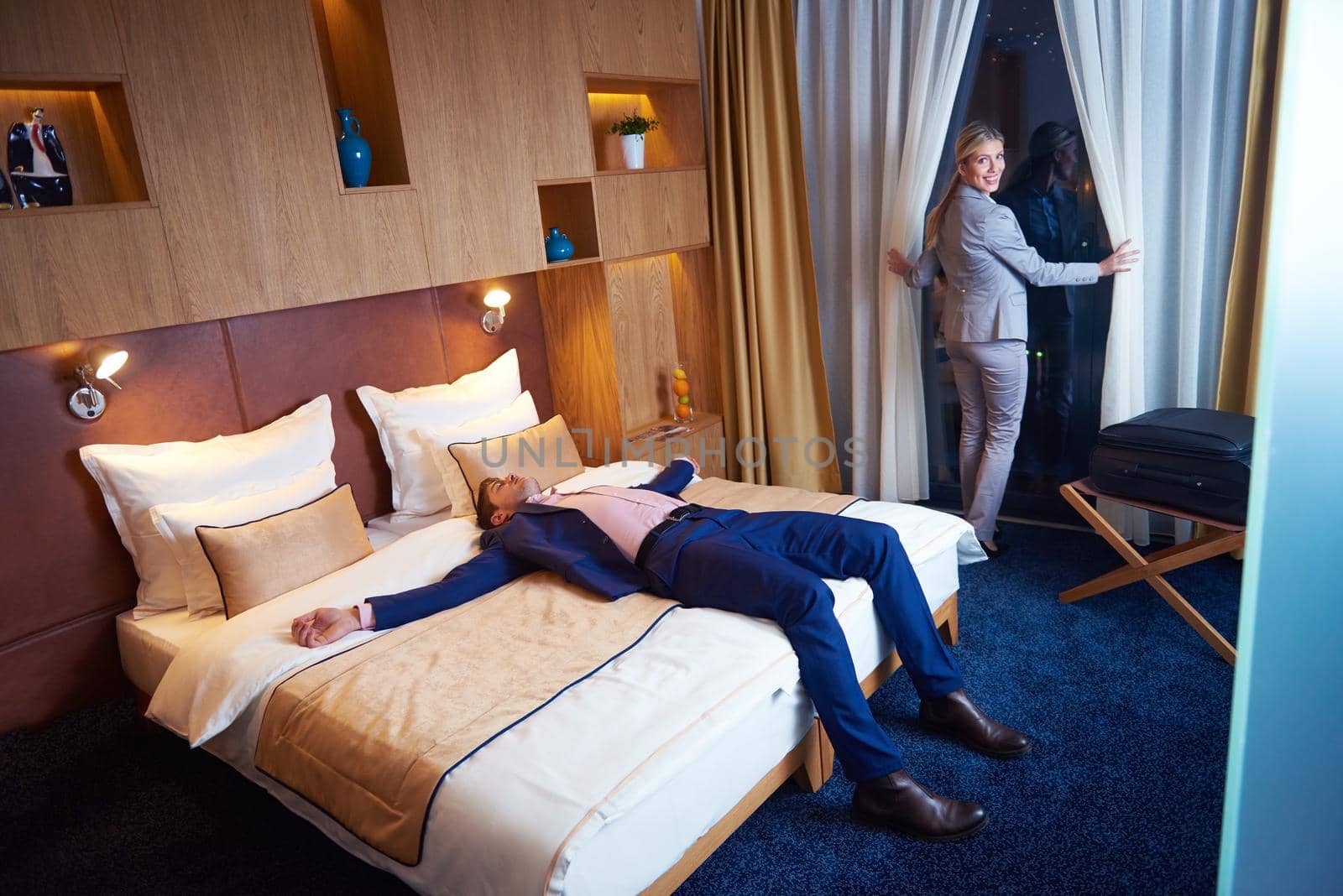 relaxed and happy young couple in modern hotel room