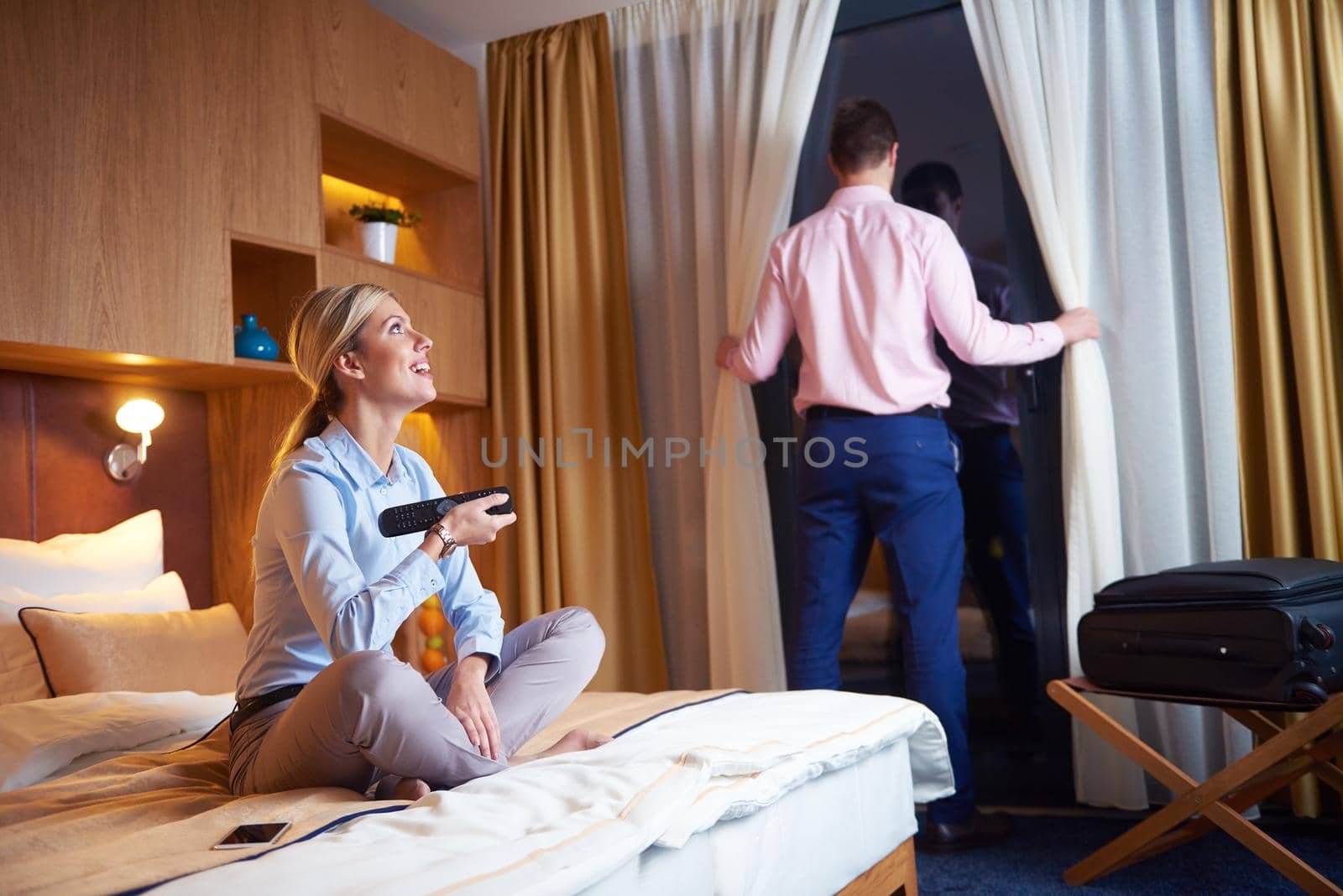 relaxed and happy young couple in modern hotel room