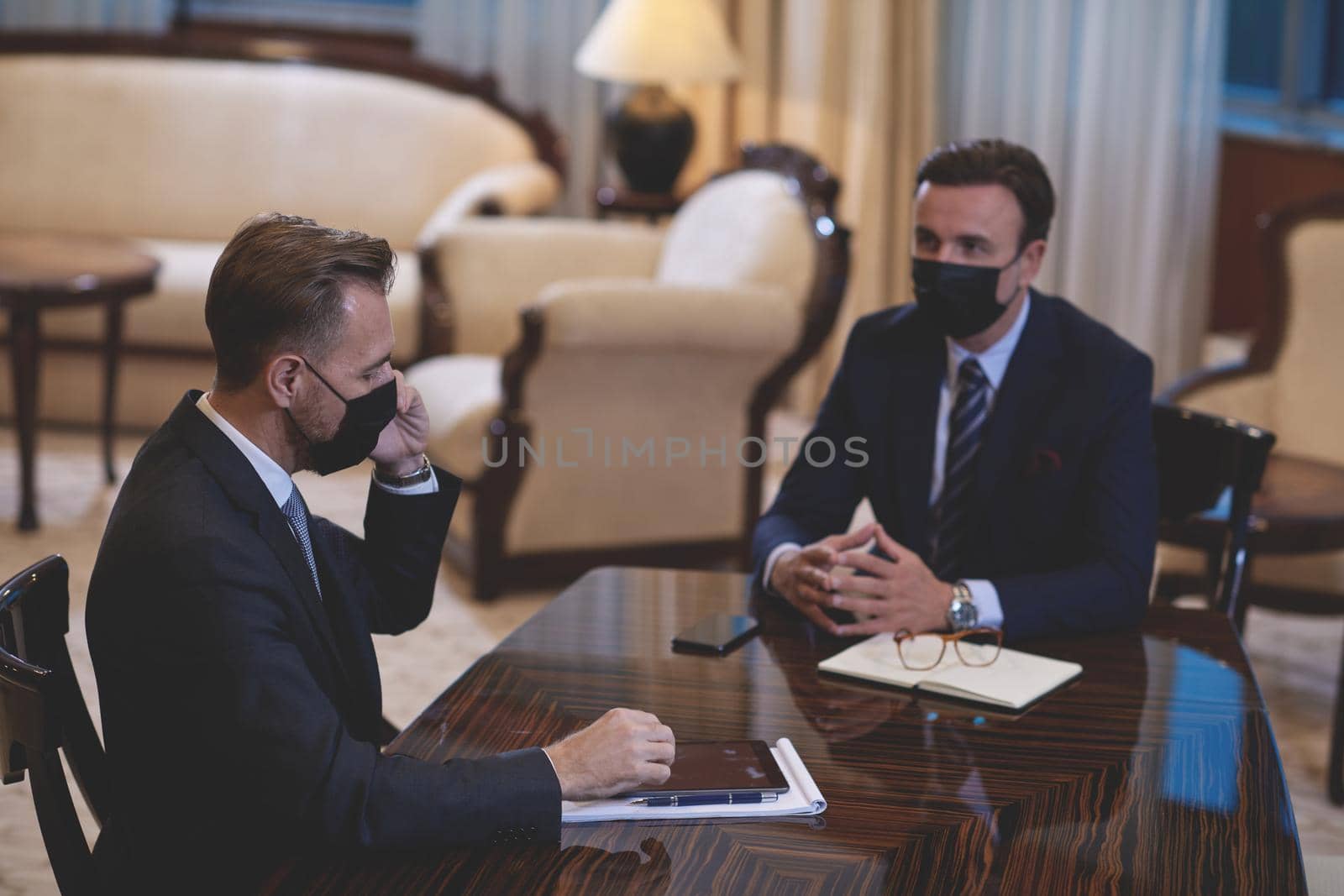 corporate business people team on meeting in luxury office  wearing crona virus protection face mask keep social distance