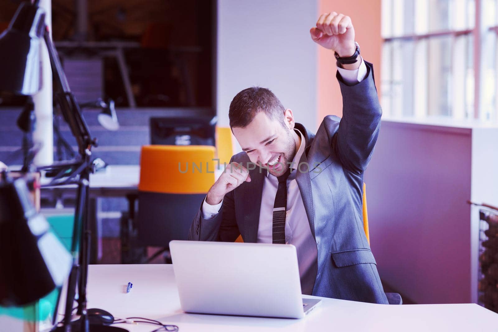 happy young business man portrait in bright modern office indoor