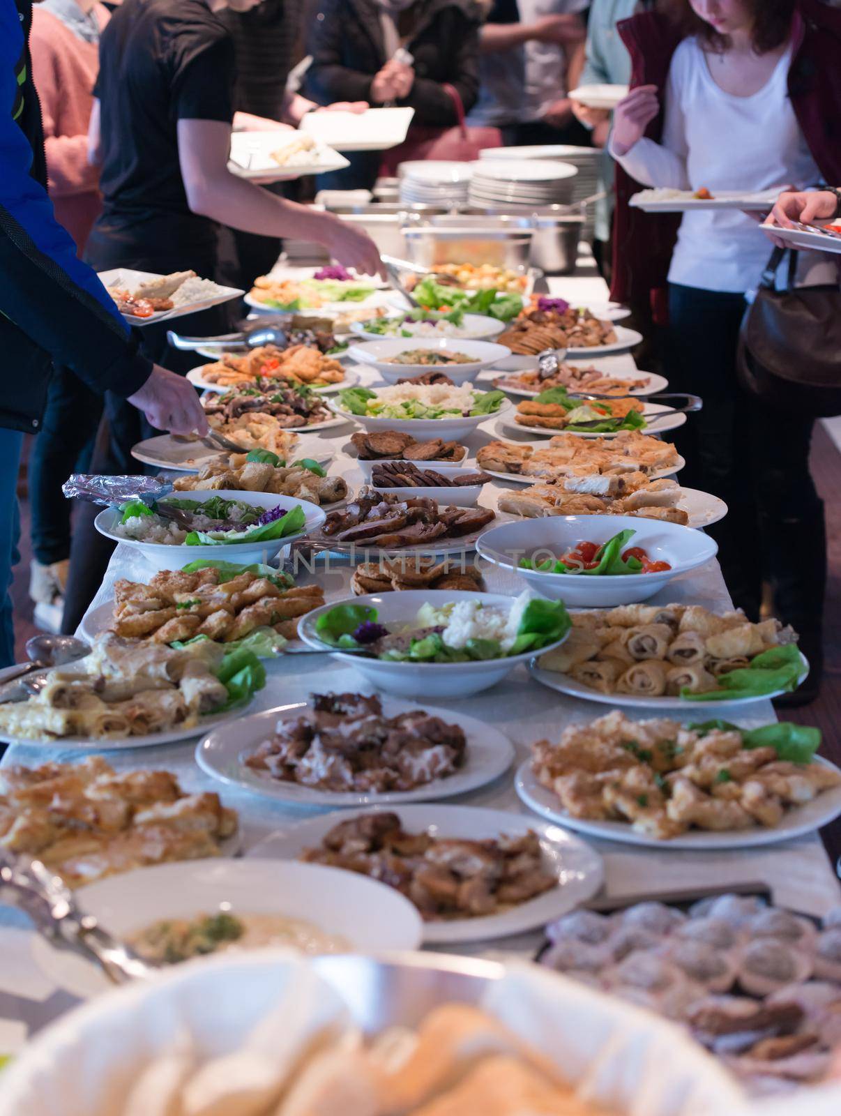 people group catering buffet food indoor in school  restaurant with meat colorful fruits and vegetables