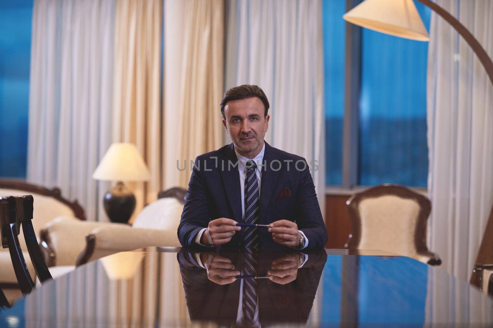 corporate businessman holding  pen and gesturing with hands concpet of business deal