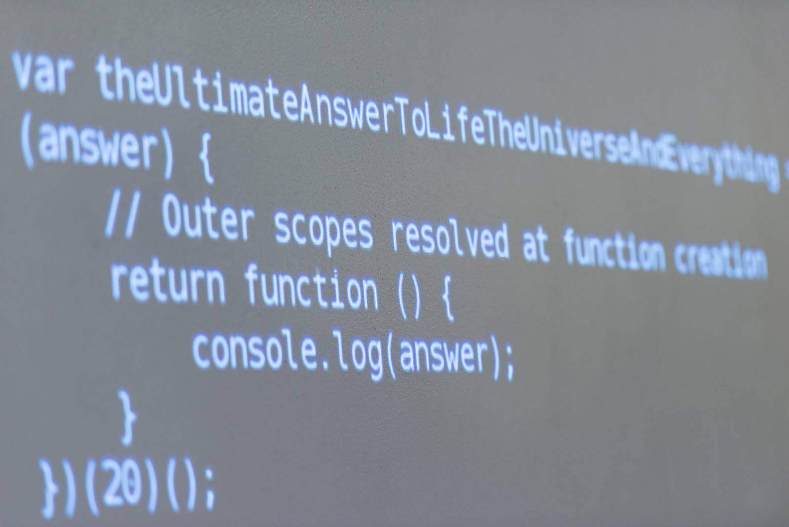 java program code on projector screen at programming class