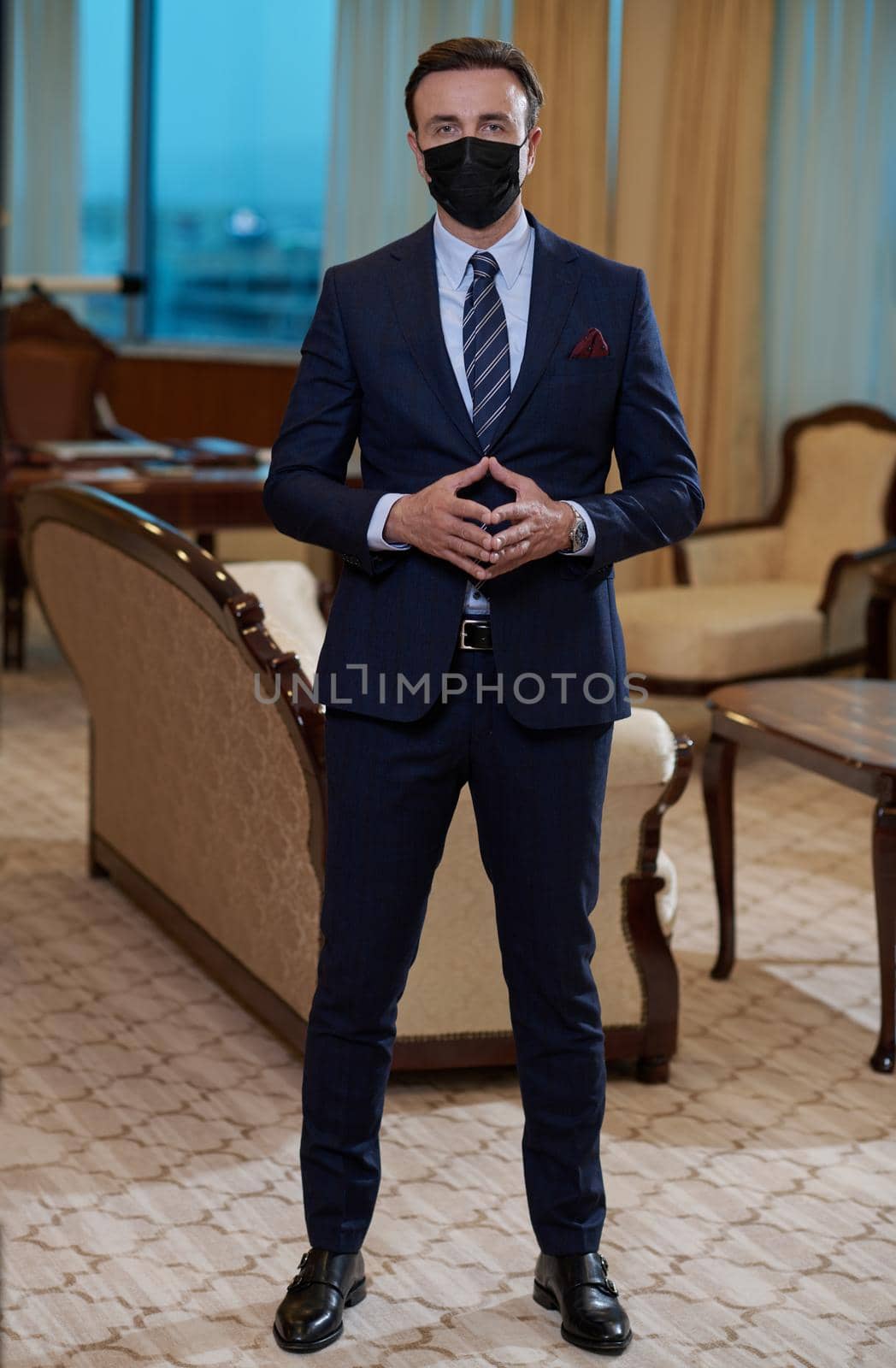 corporate business man wearing protective medical face mask at luxury office